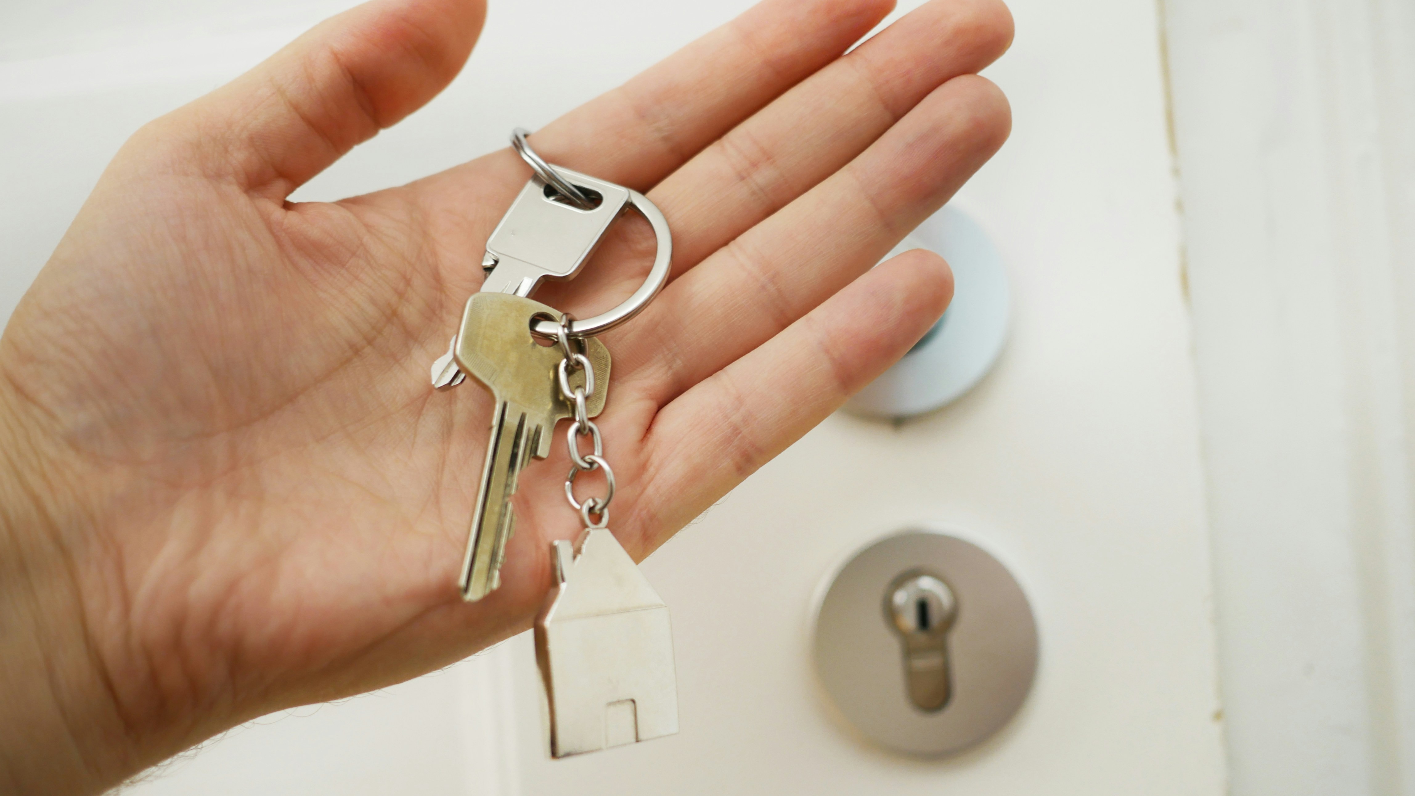 Person holding house keys