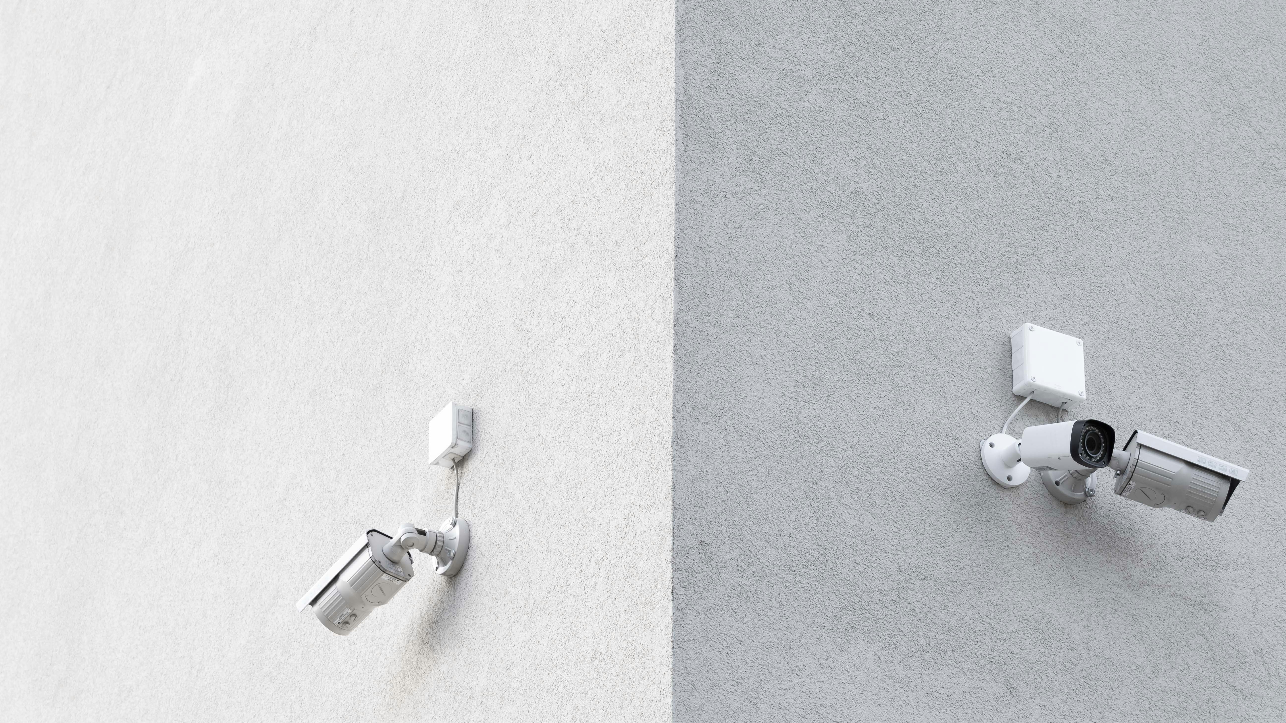 CCTV cameras attached to a wall