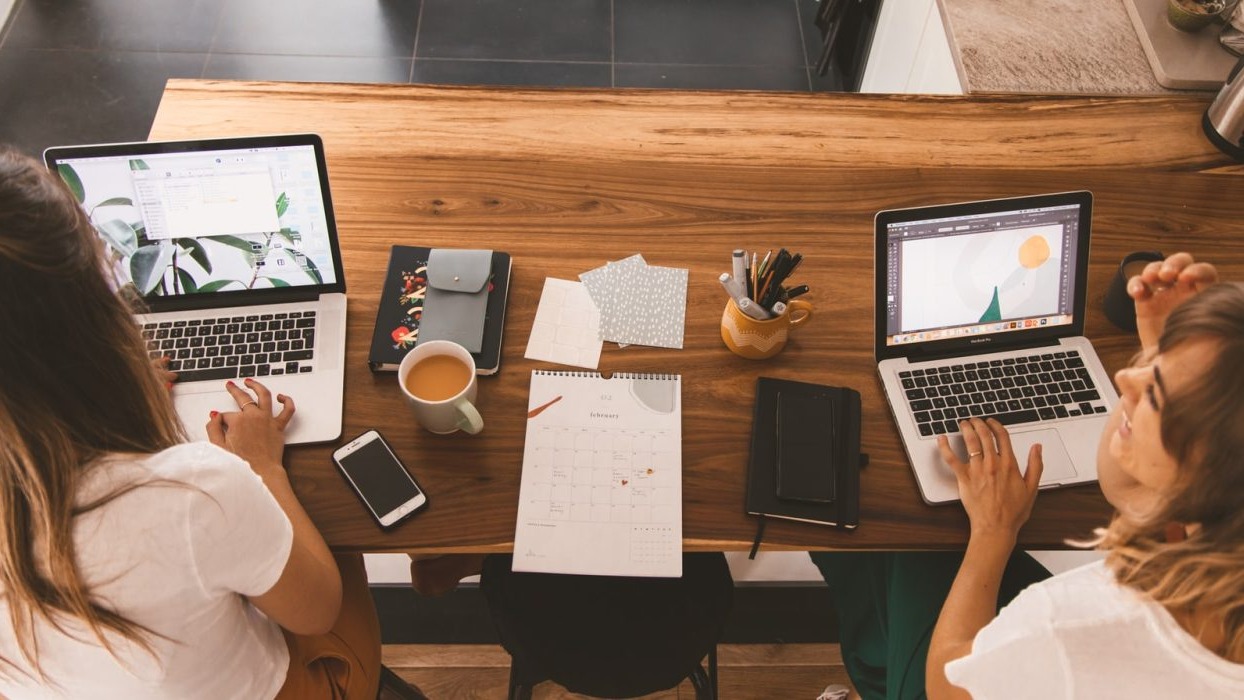 Two people working at a desk
