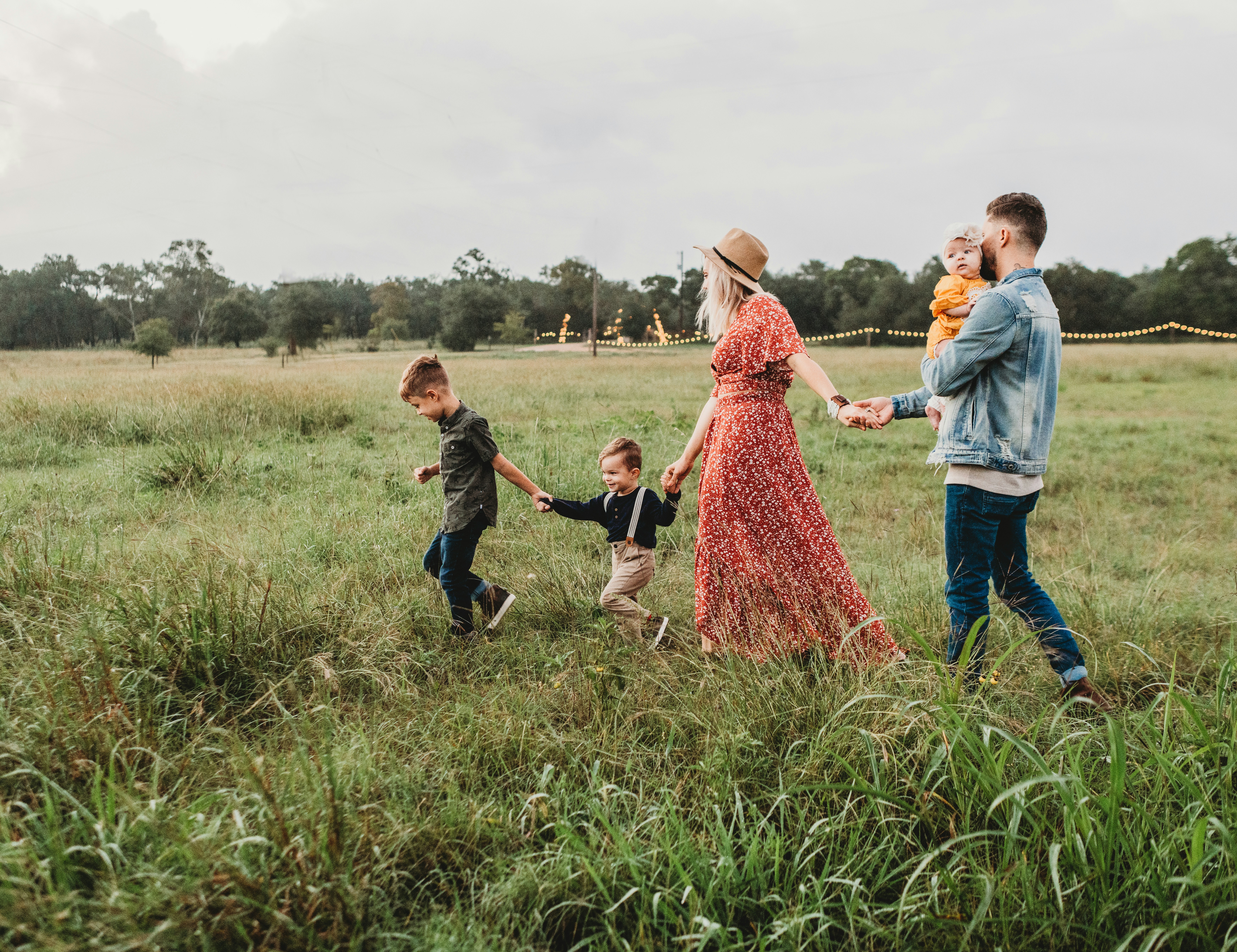Family in field walking towards something