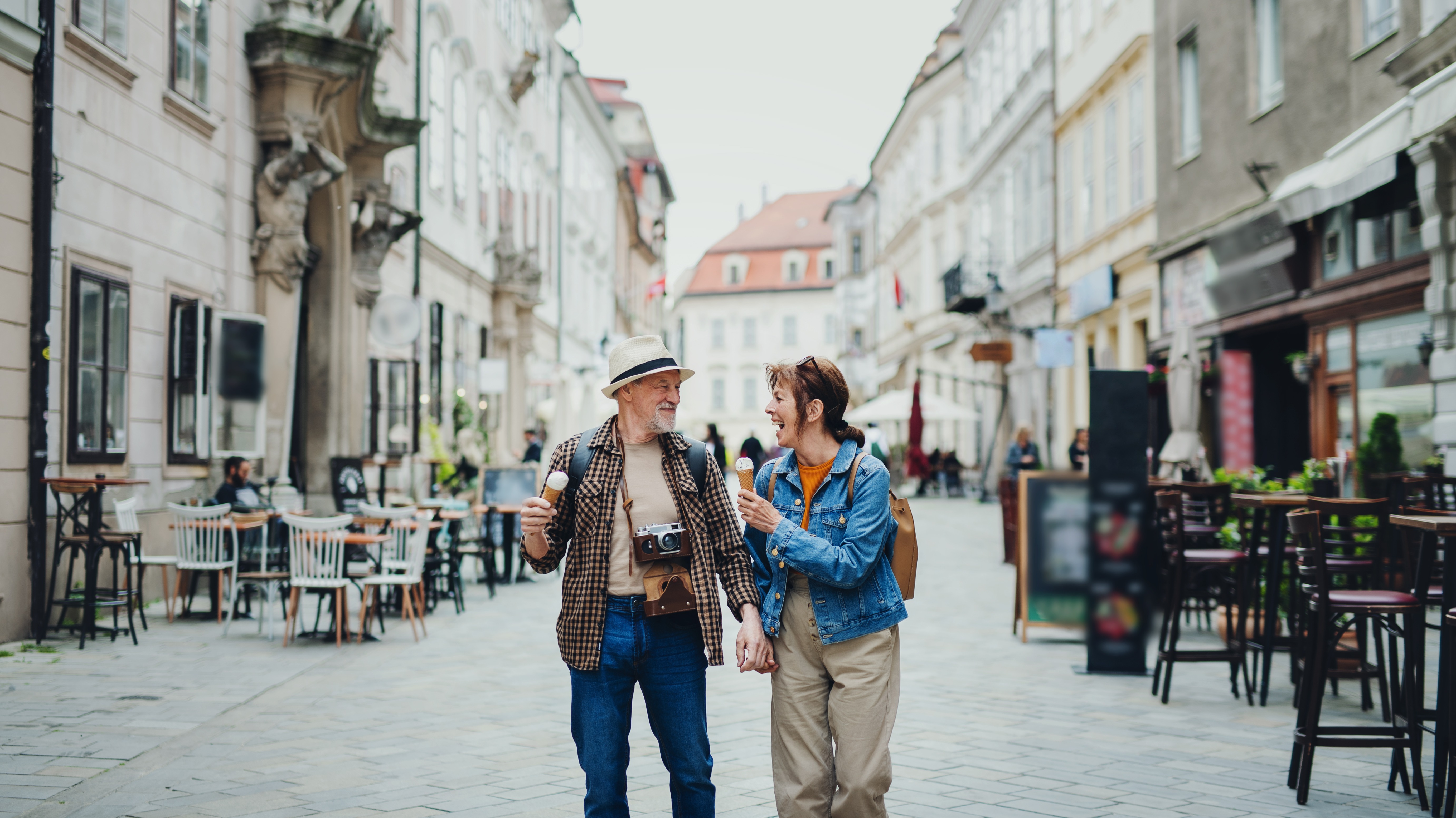 Couple eating ice-cream whilst on holiday