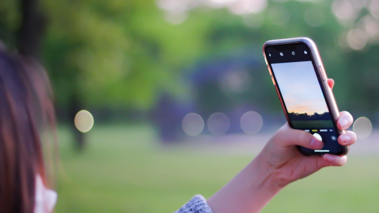 Person taking a photograph