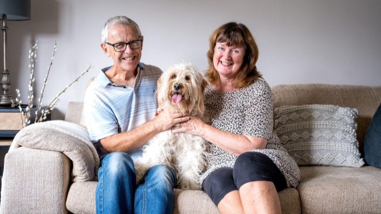 Beanie with her owners Martin and Jane