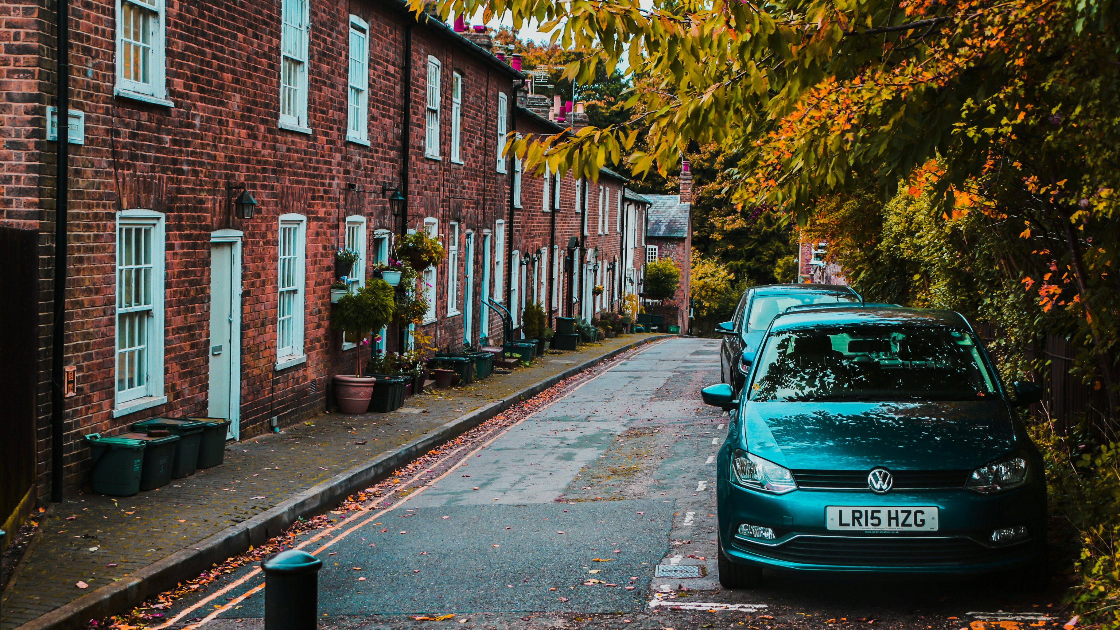 Row of houses with car parked in front