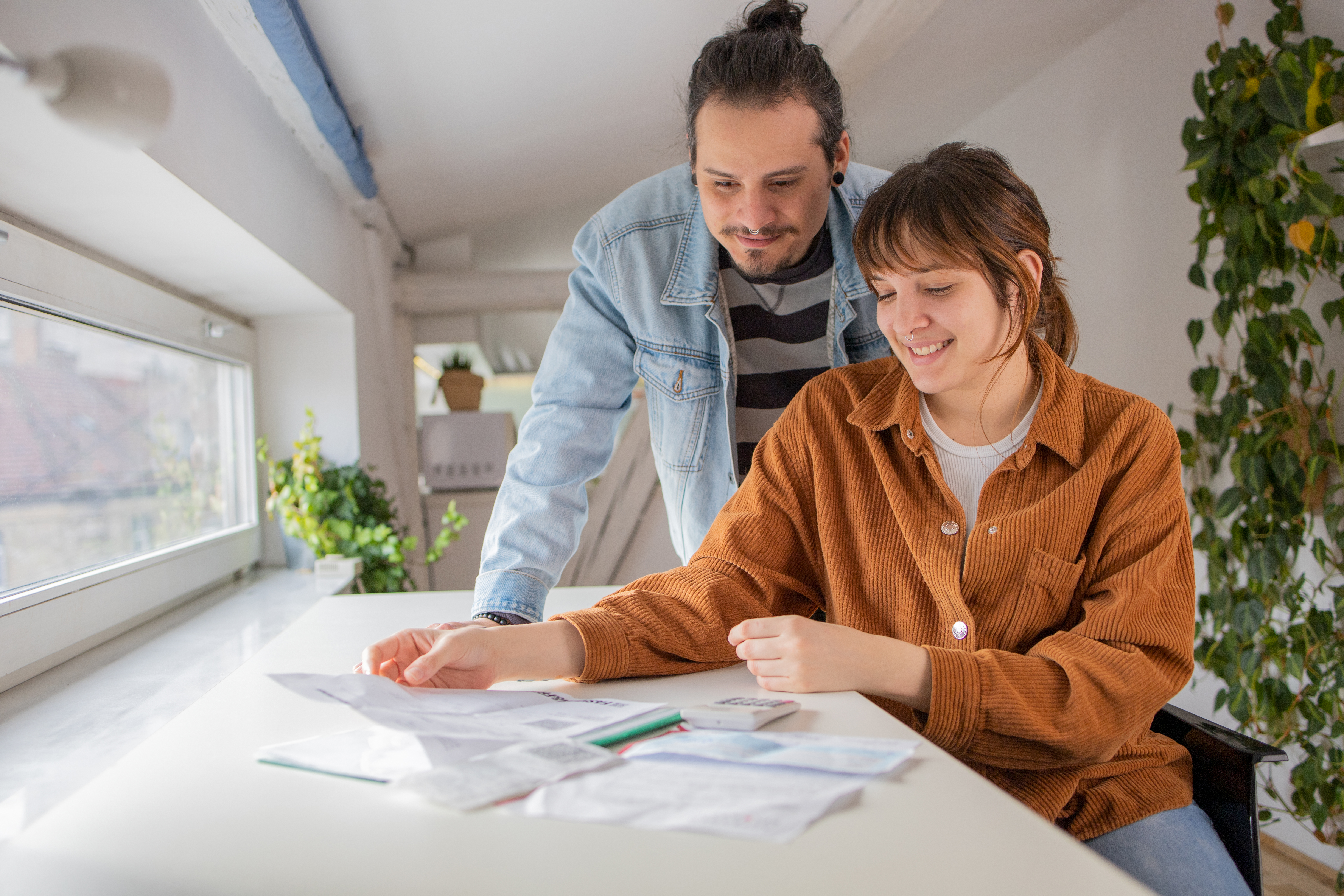 Couple looking through their bills