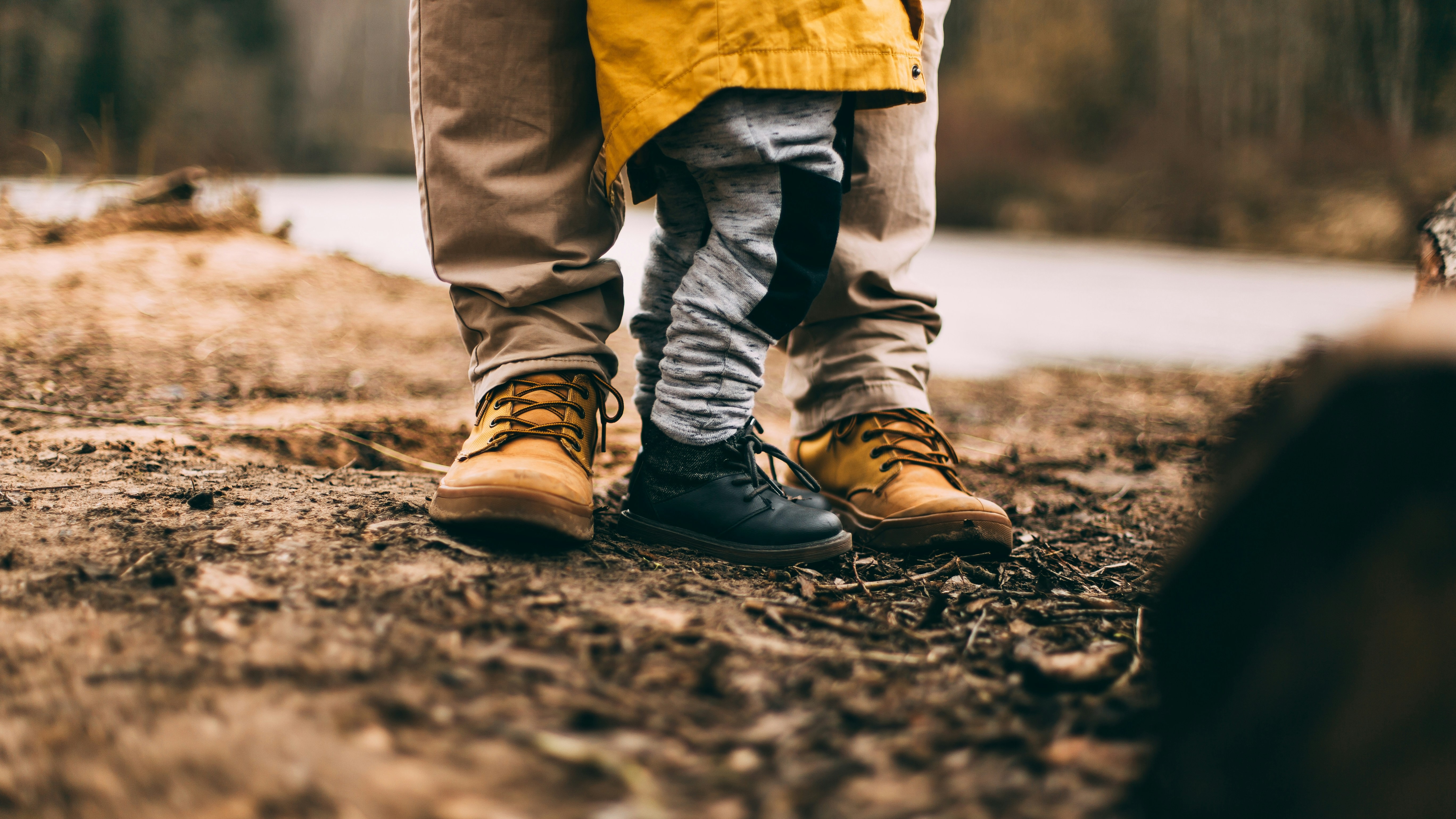 Person and child stood in a forest