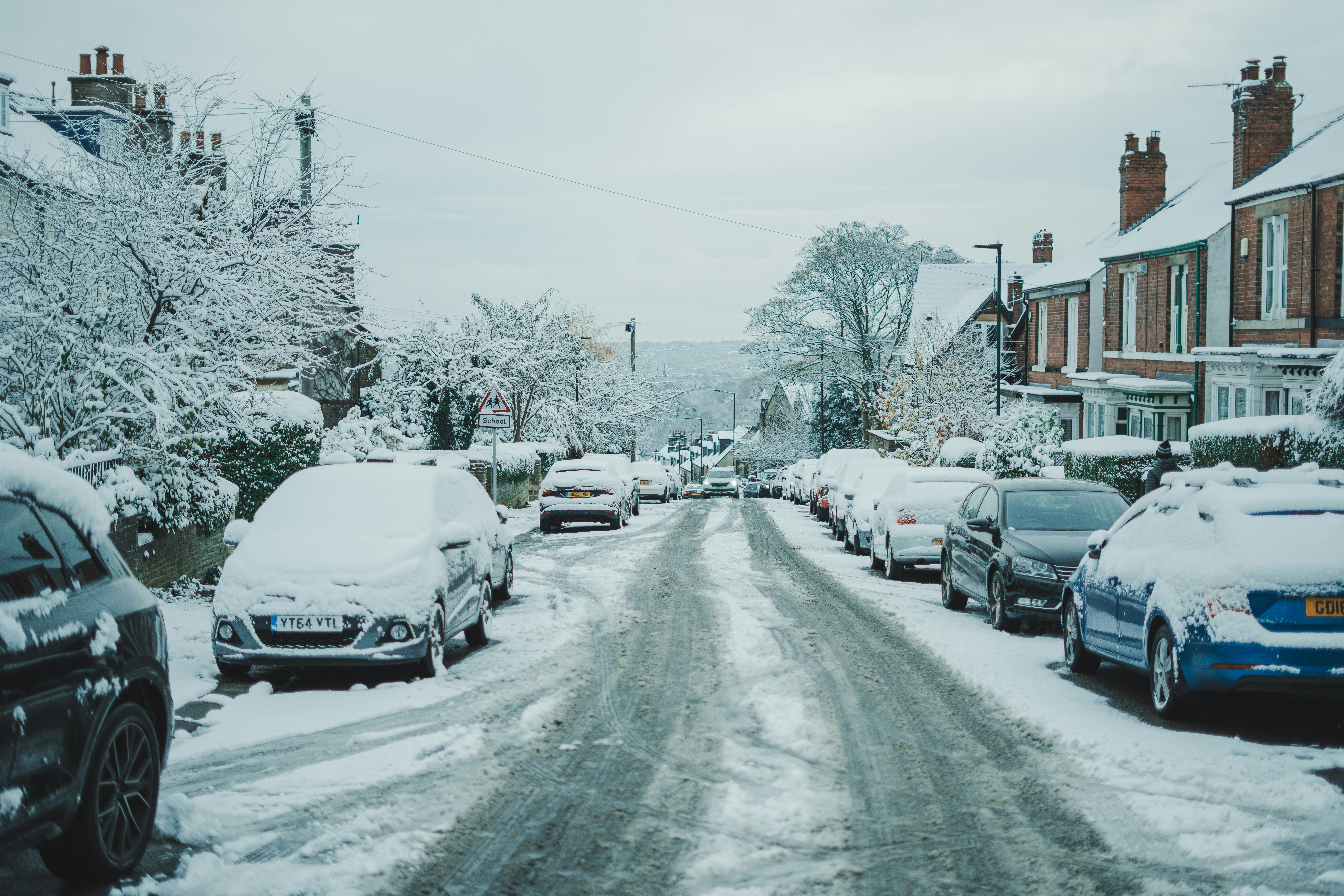 Cars parked on a snowy road