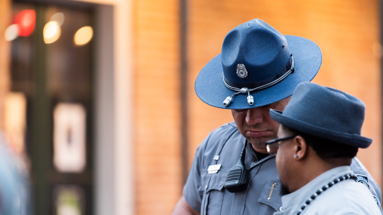 Person speaking to a police officer