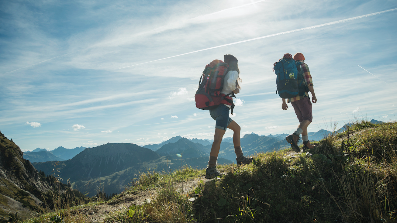 People walking in the mountains with rucksacks