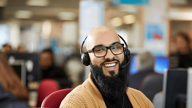 Young male wearing a headset.