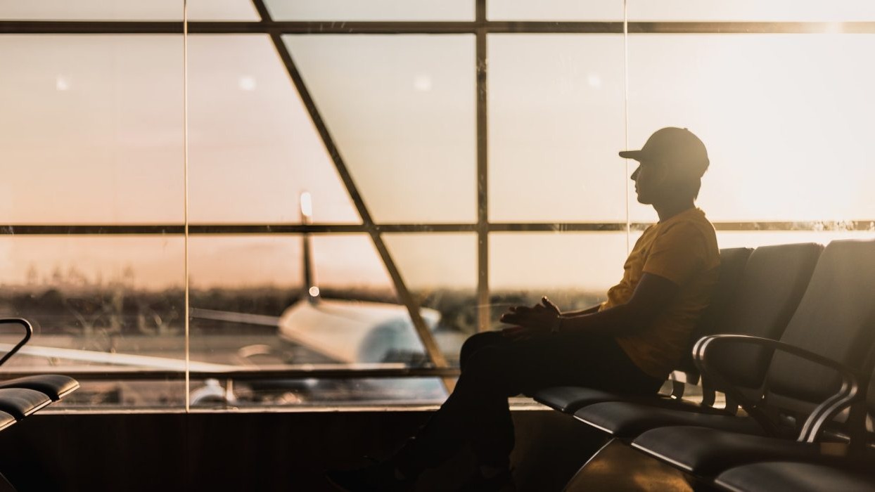 Person sitting in an airport lounge