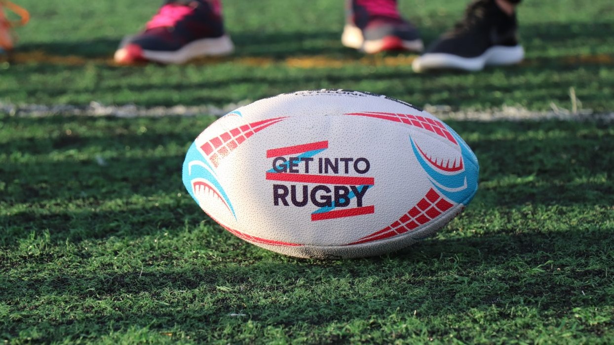 Rugby ball with writing on the side