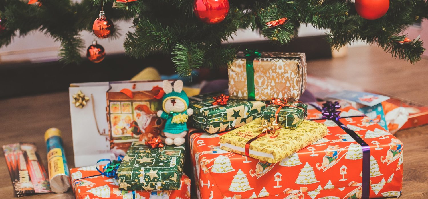 Christmas presents wrapped under tree