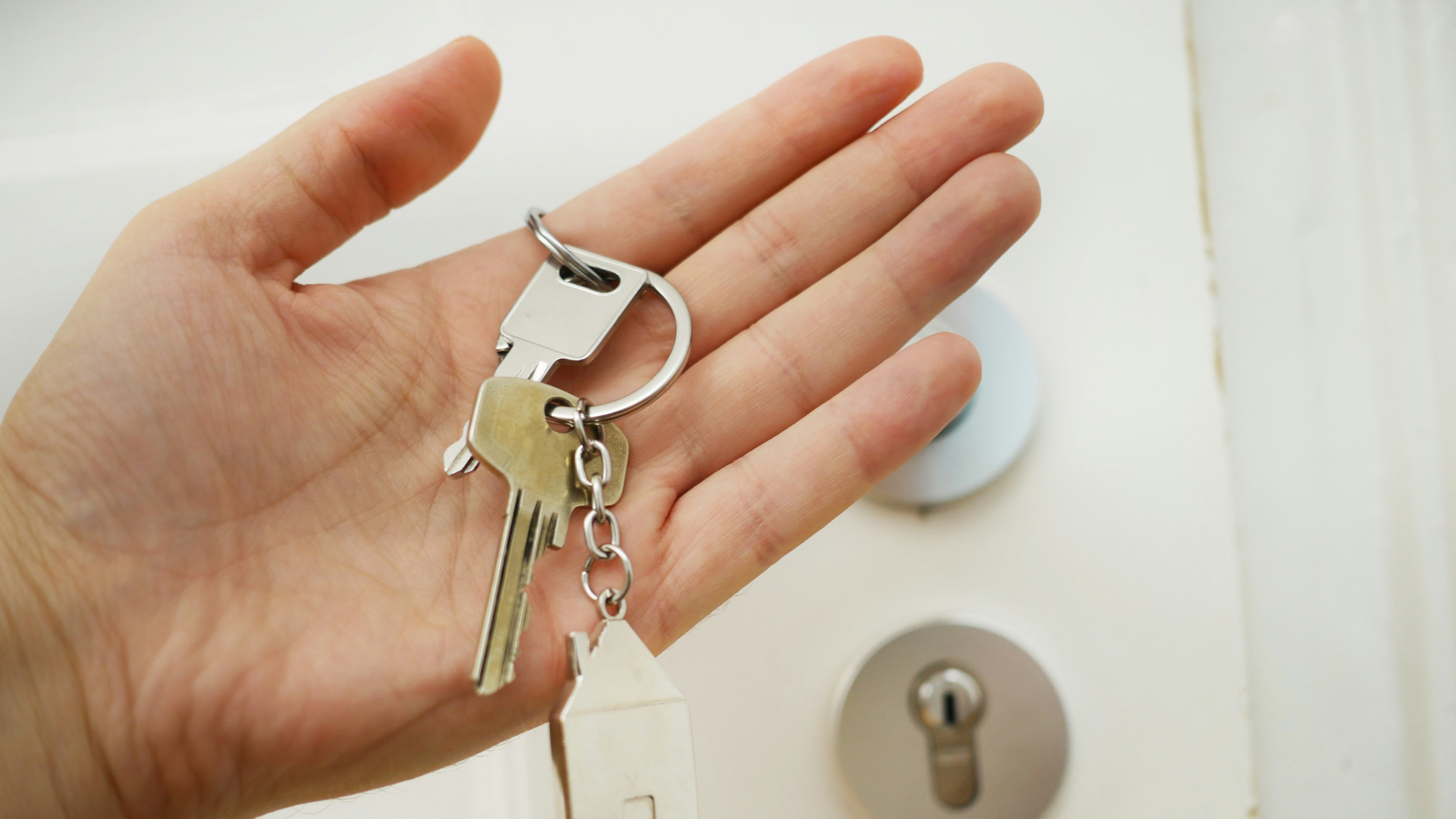 Person holding house keys