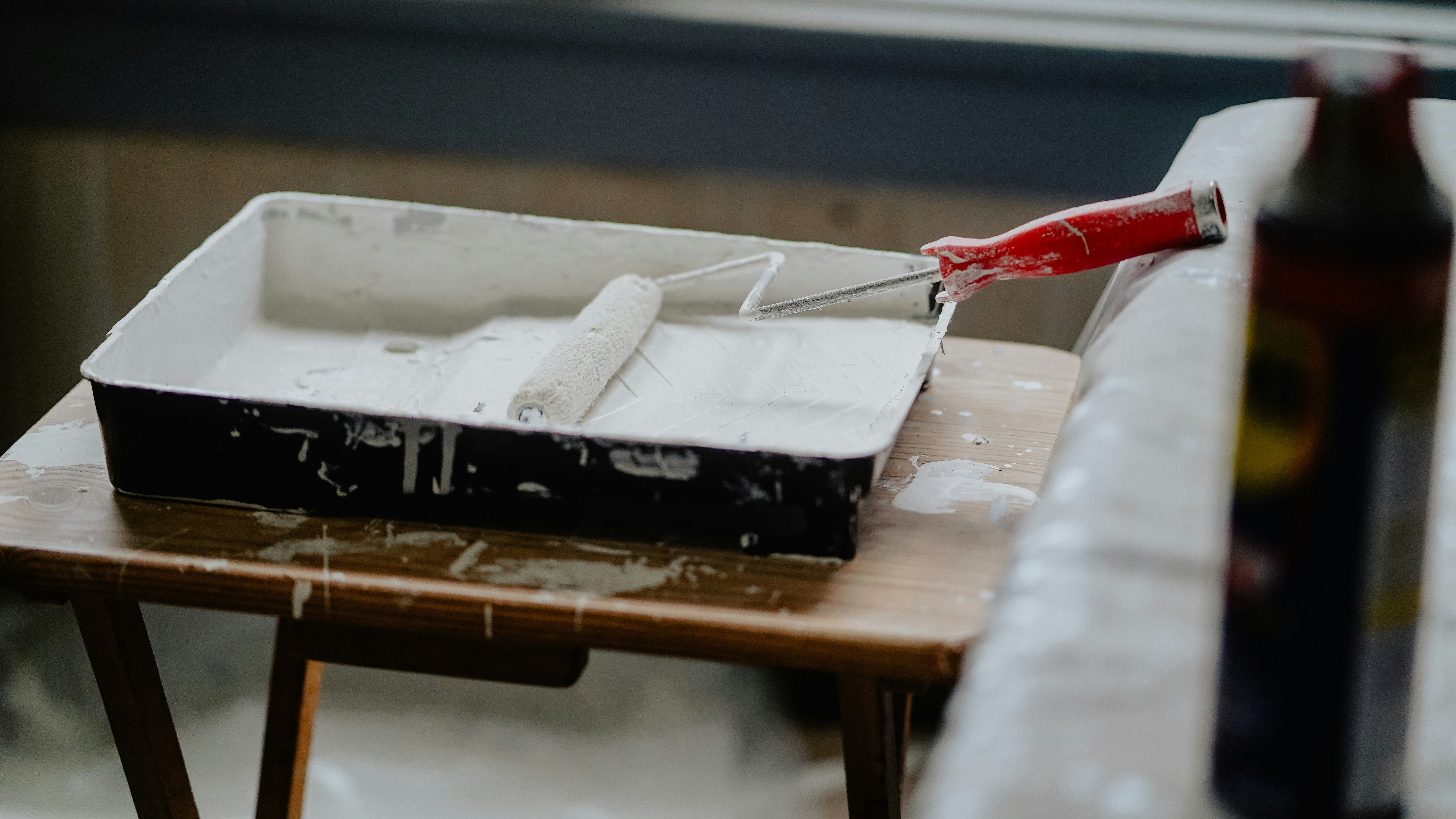 Two people with paintbrushes in their hands