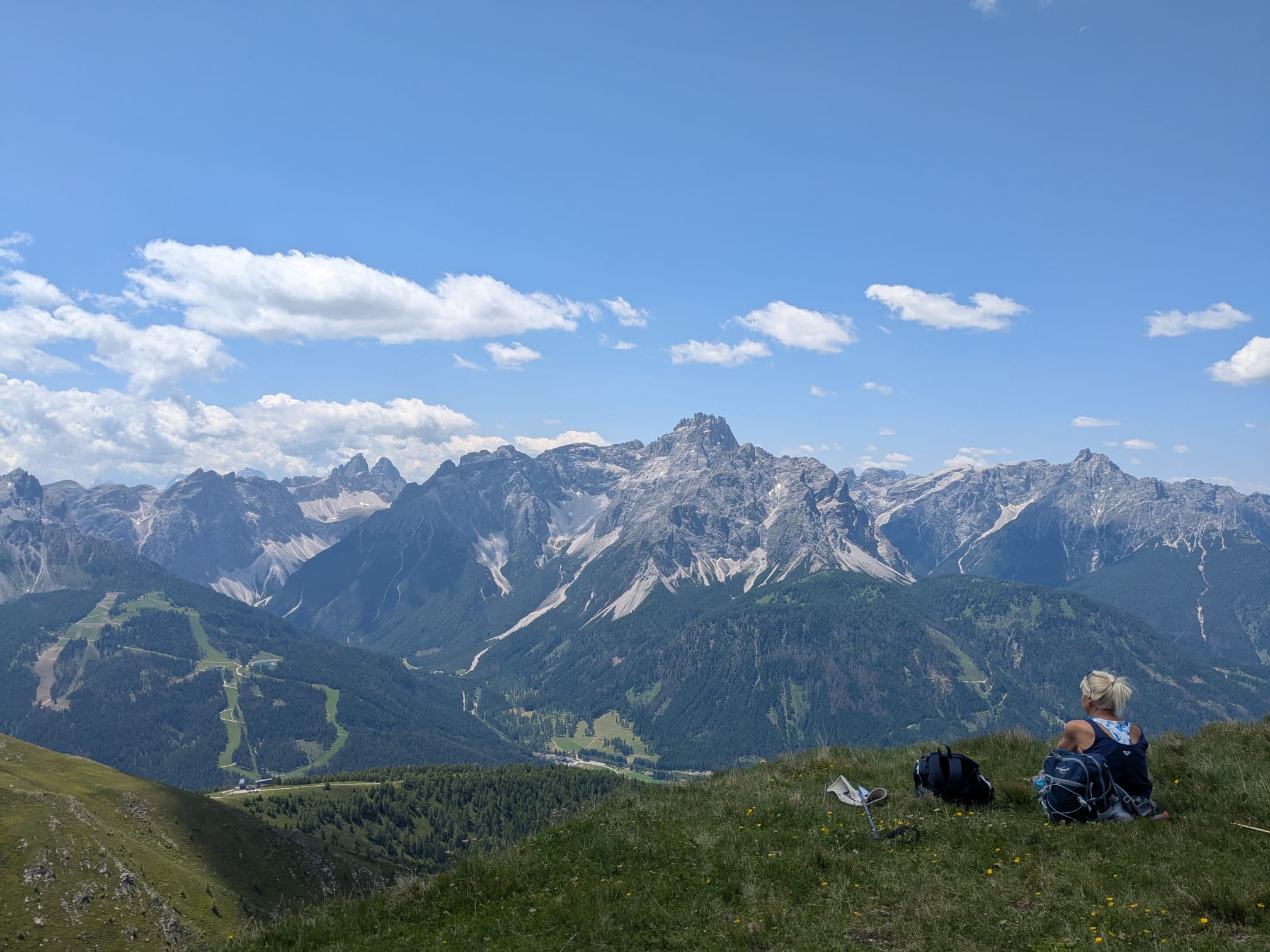Woman sitting admiring mountains