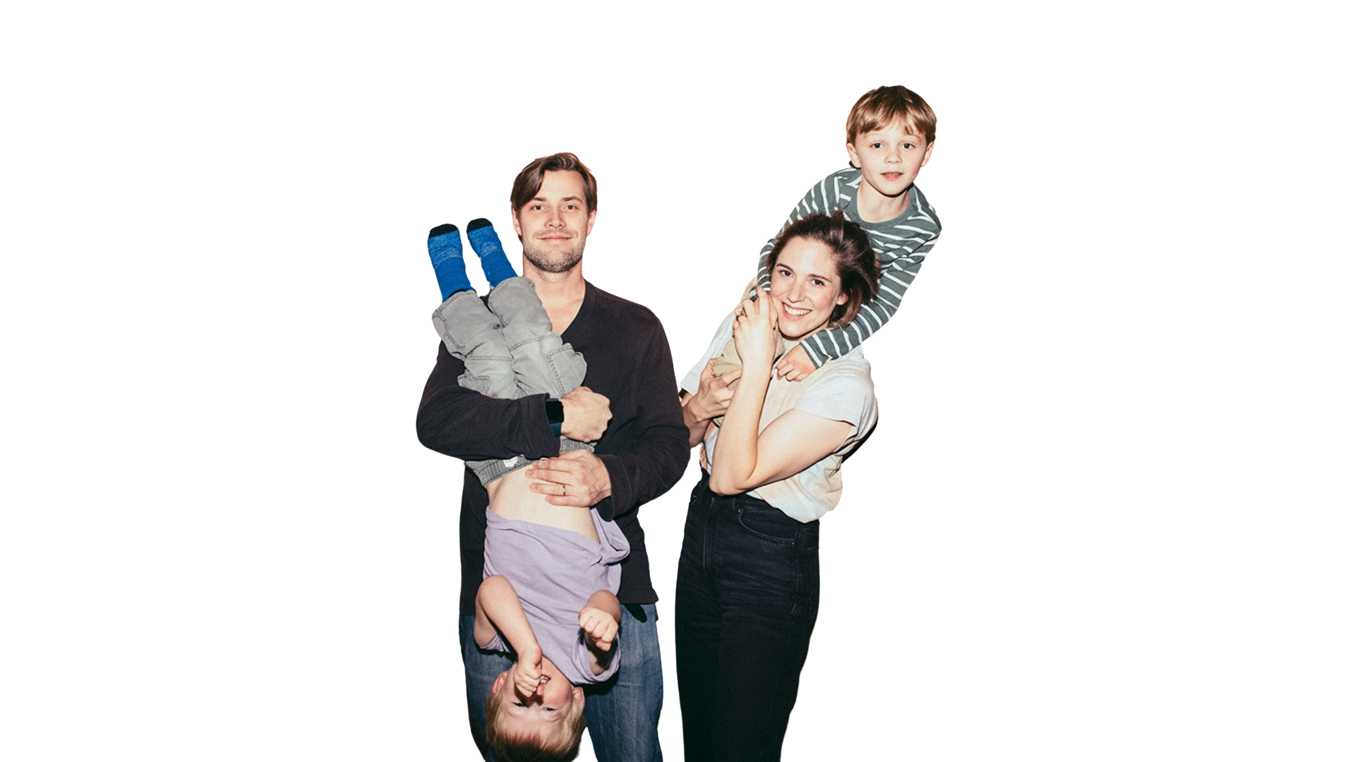 Mum and dad holding their two children