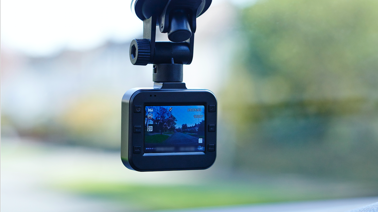 Dash cam attached to windscreen of a car