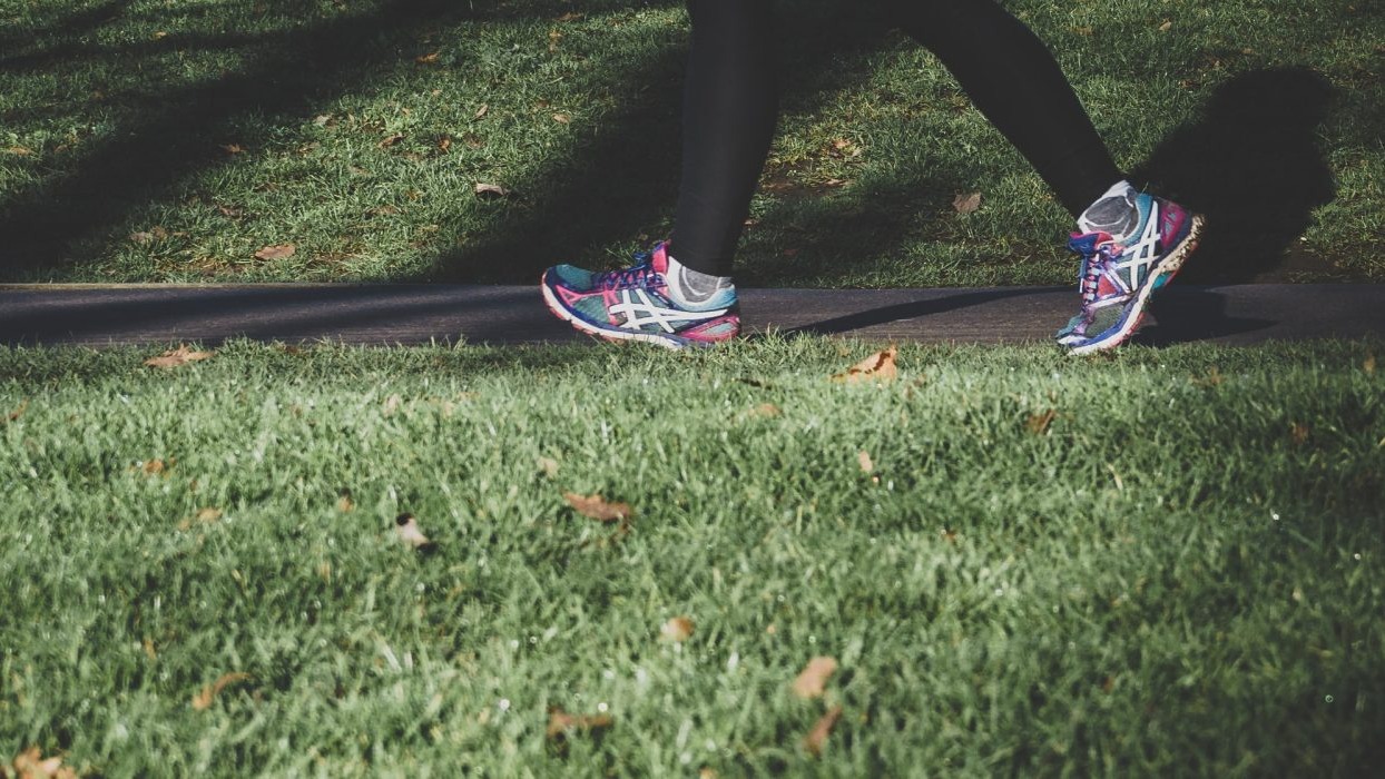 Person running along a path