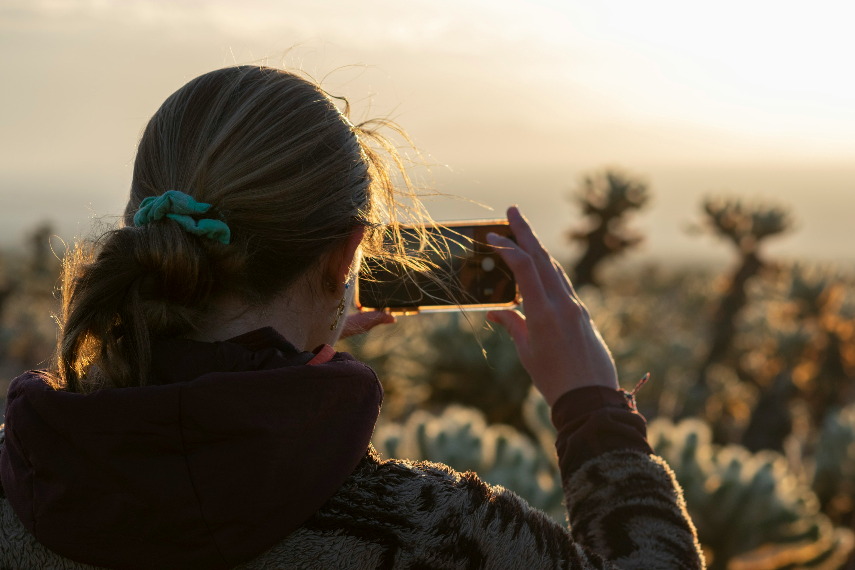 Woman taking a picture with her phone 