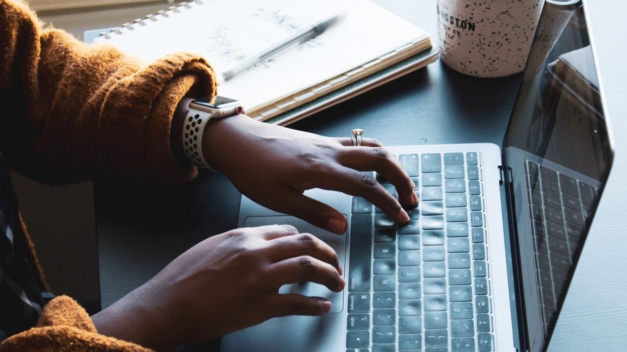 Person typing on a laptop