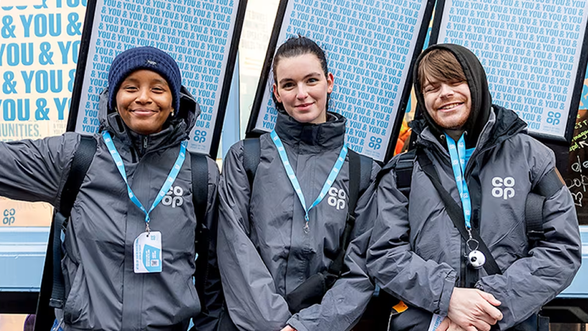3 workers wearing Co-op jackets and lanyards
