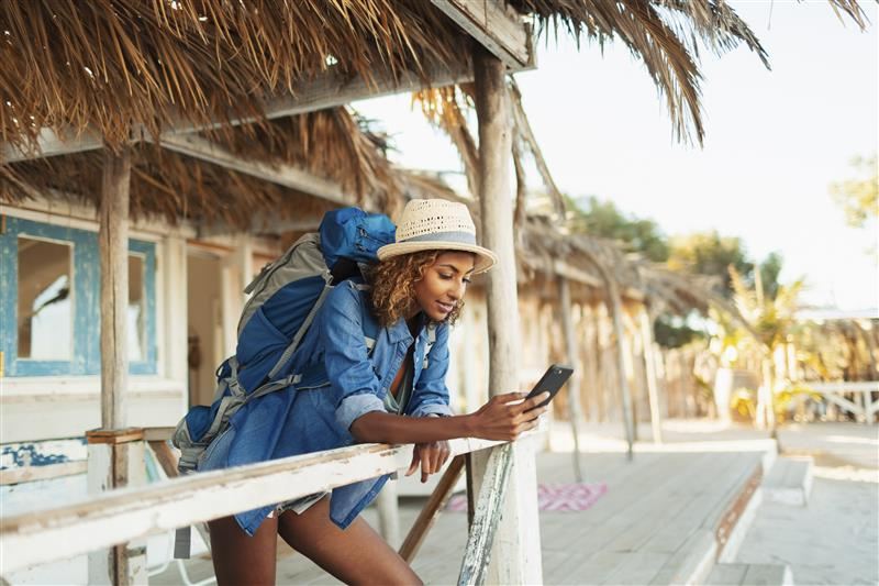 A woman on holiday wearing a backpack