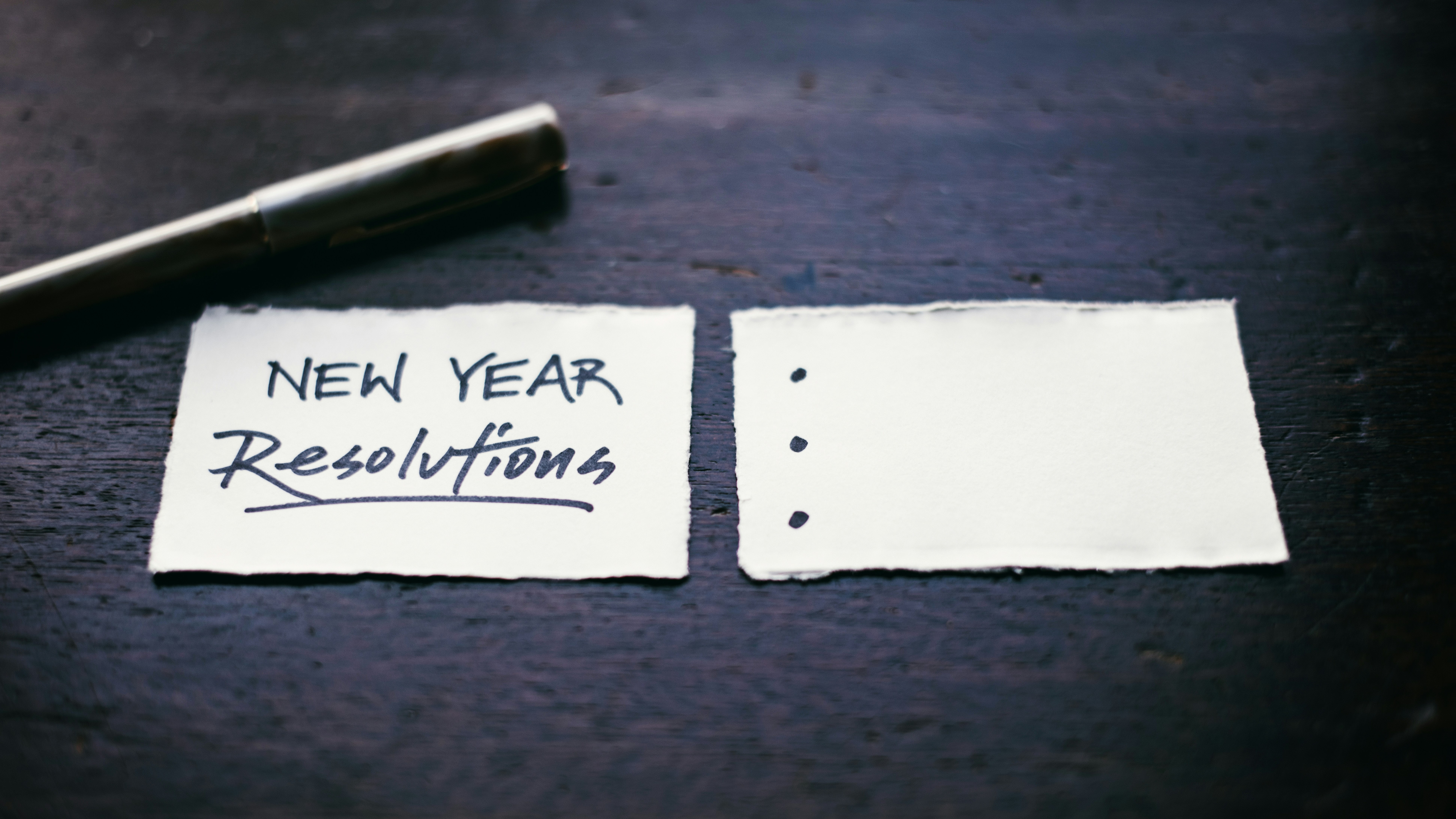 A pen and paper to write New Year's resolutions