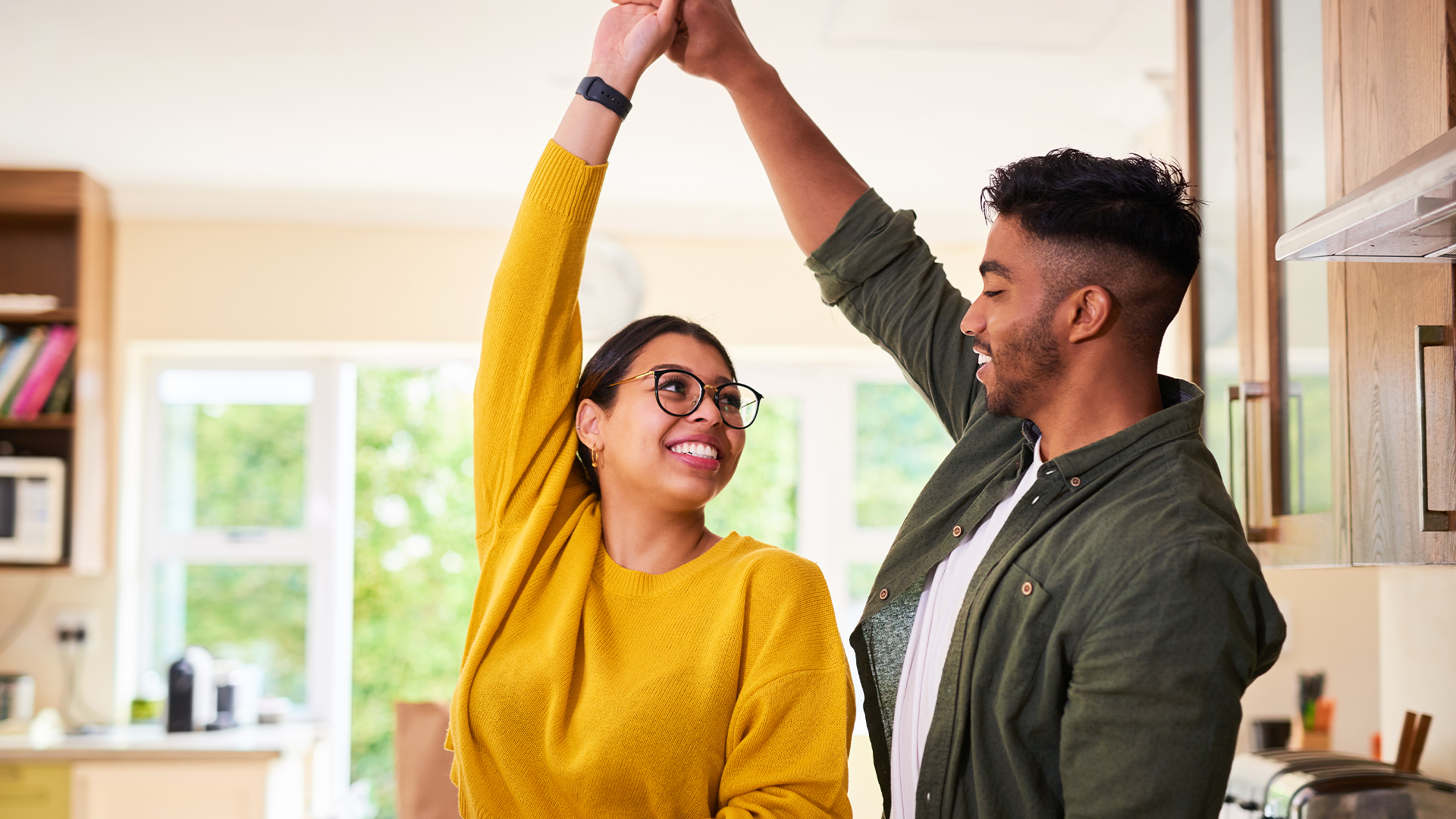 A couple dancing the the kitchen