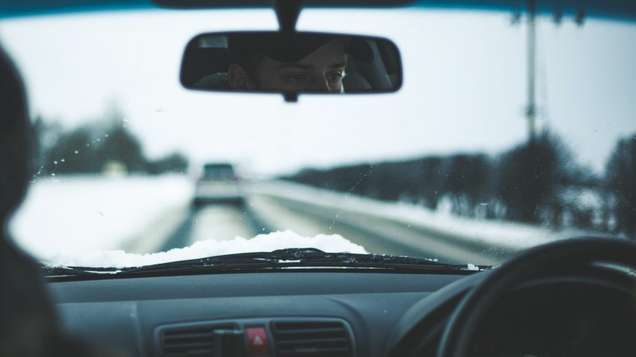 Person driving a car in the winter