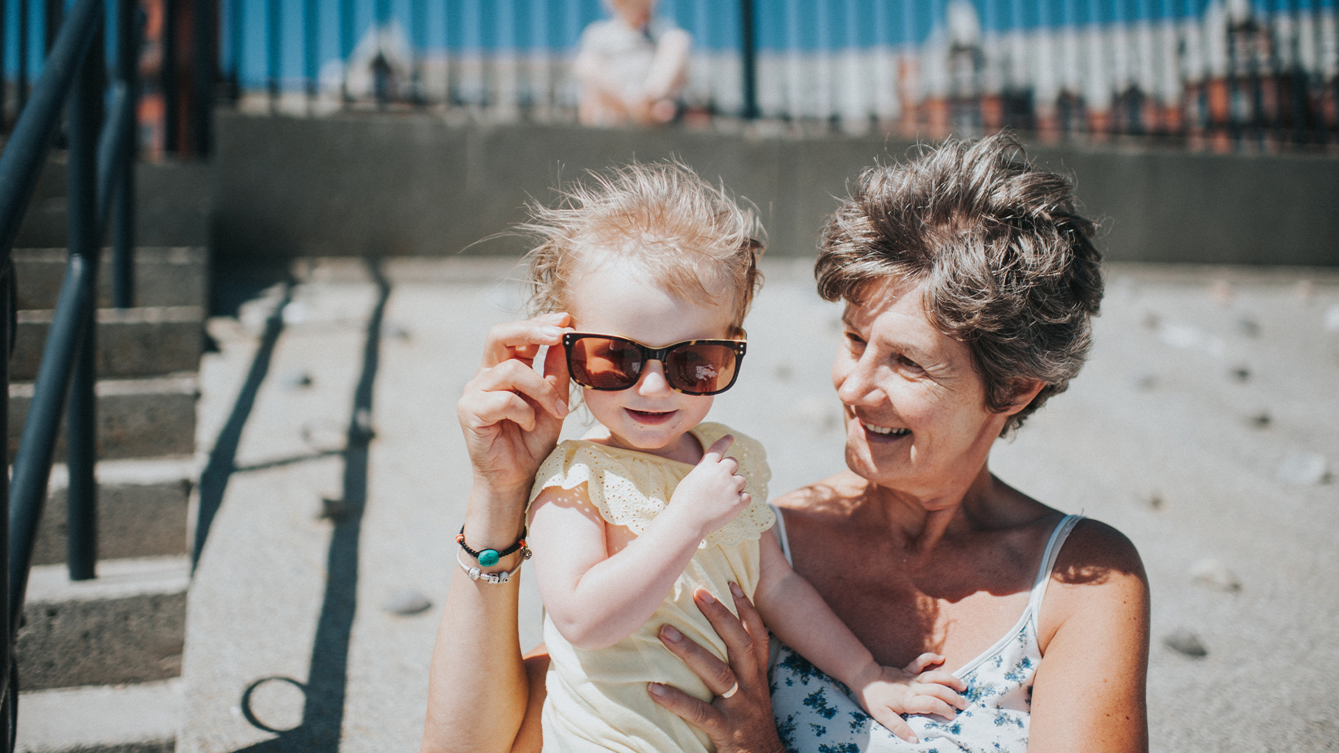 Grandmother and grandson on the beach