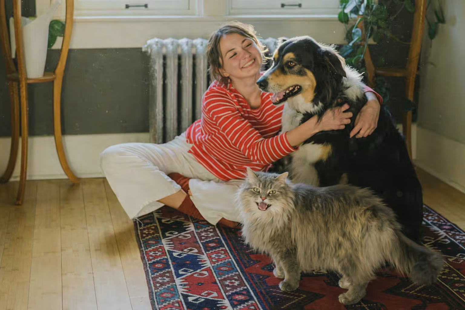 woman with cat and dog