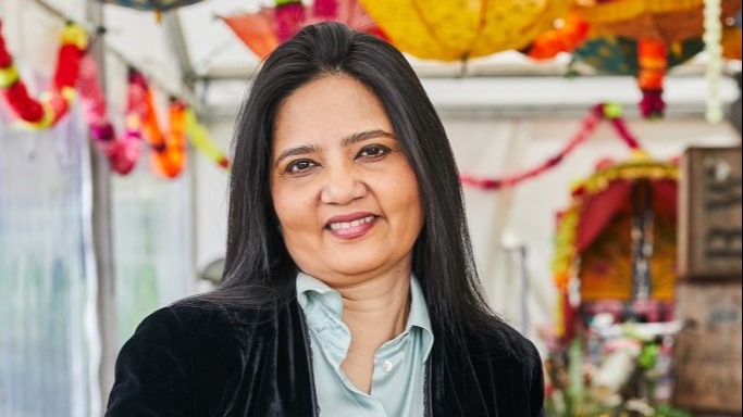 A picture of Mandira Sarkar holding food