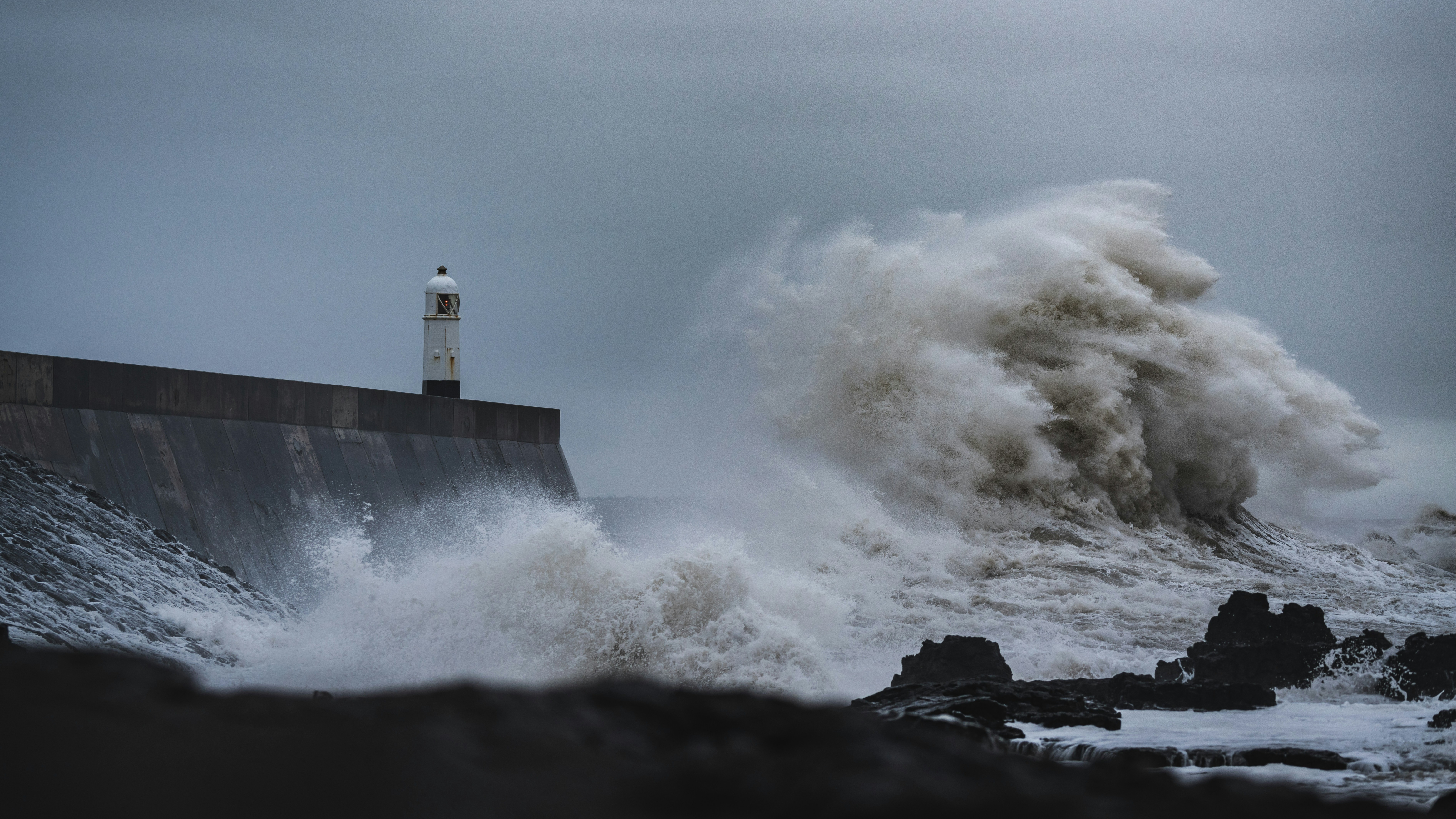 Waves crashing against coastline