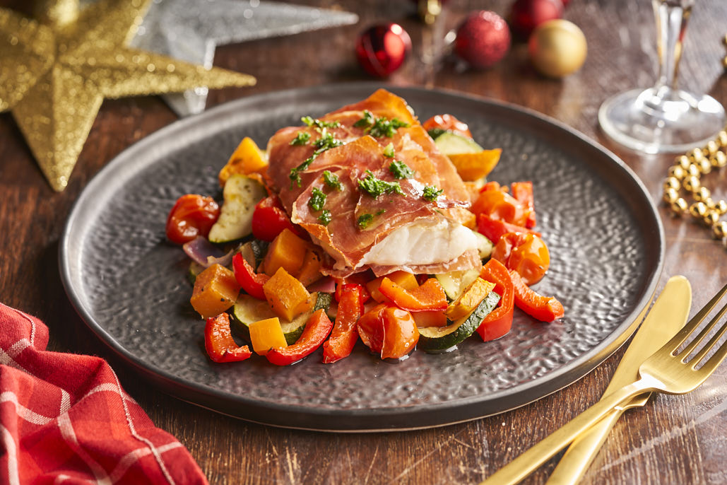 Kabeljauwpakketjes met Serranoham en ovengroenten met kruidenolie