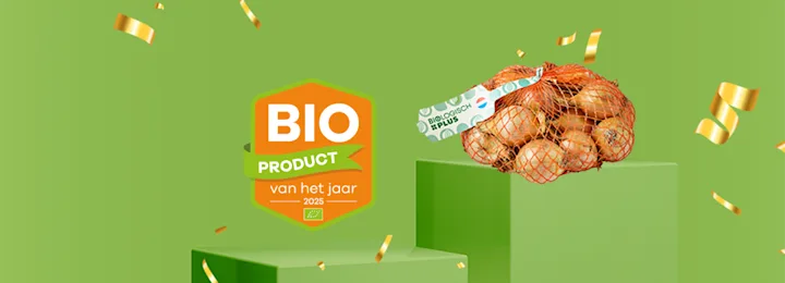 Zak biologische uien in net, met medaille “Bio product van het jaar 2025”, omgeven door gouden confetti.