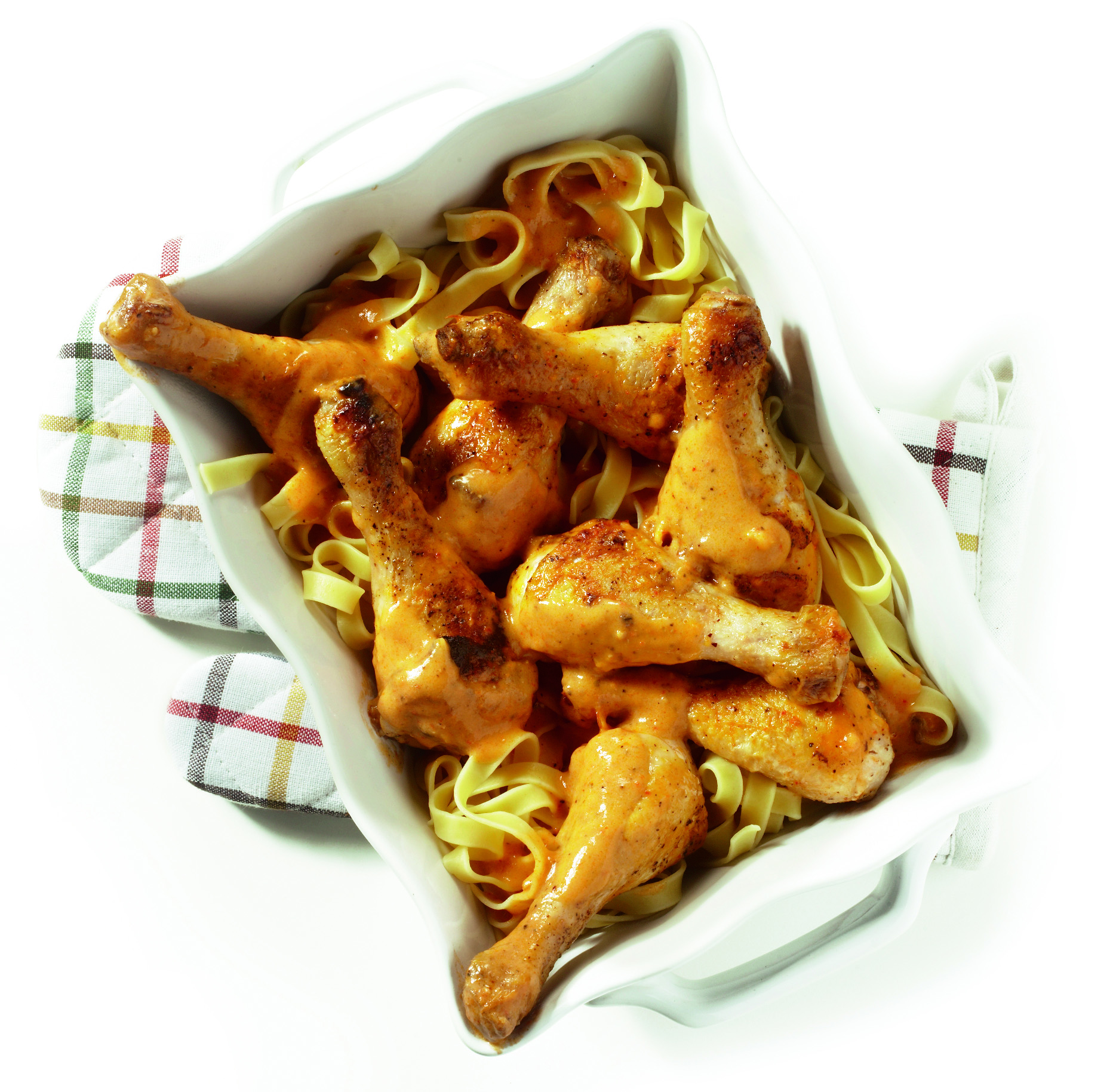 Drumsticks in pesto-roomsaus met pasta