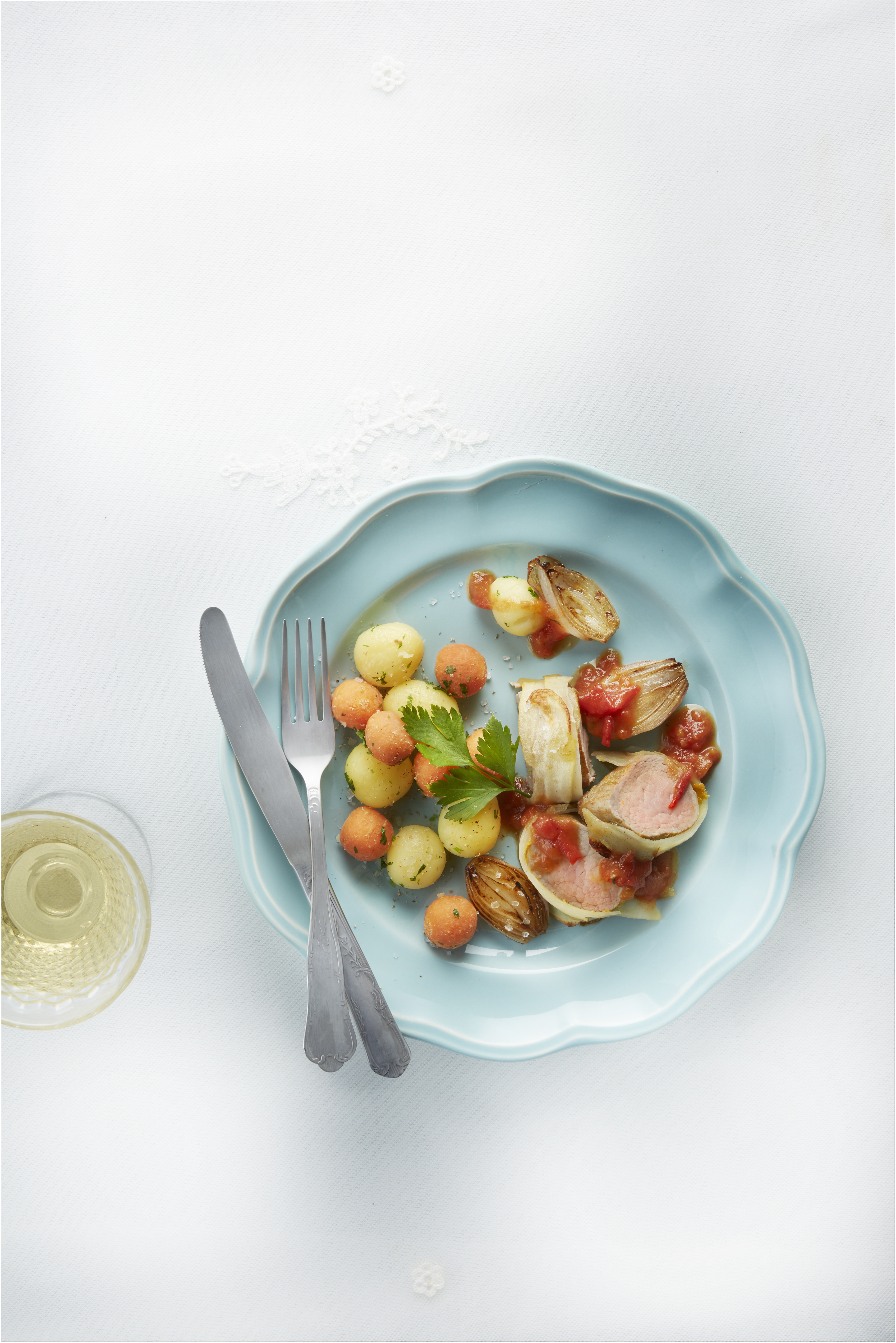 Varkenshaasmedaillons met sinaasappel-tomatensaus