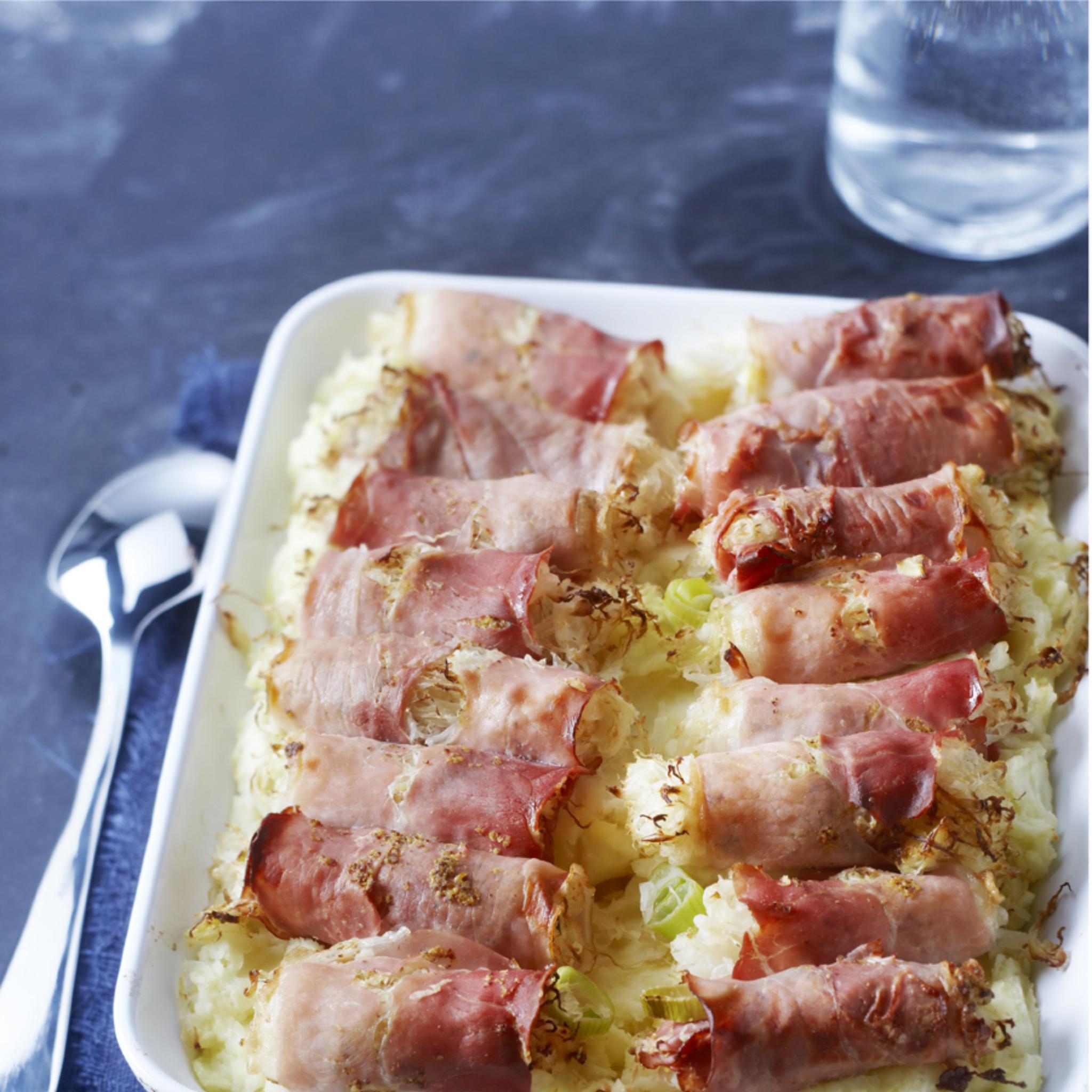 Zuurkoolrolletjes met rauwe ham uit de oven