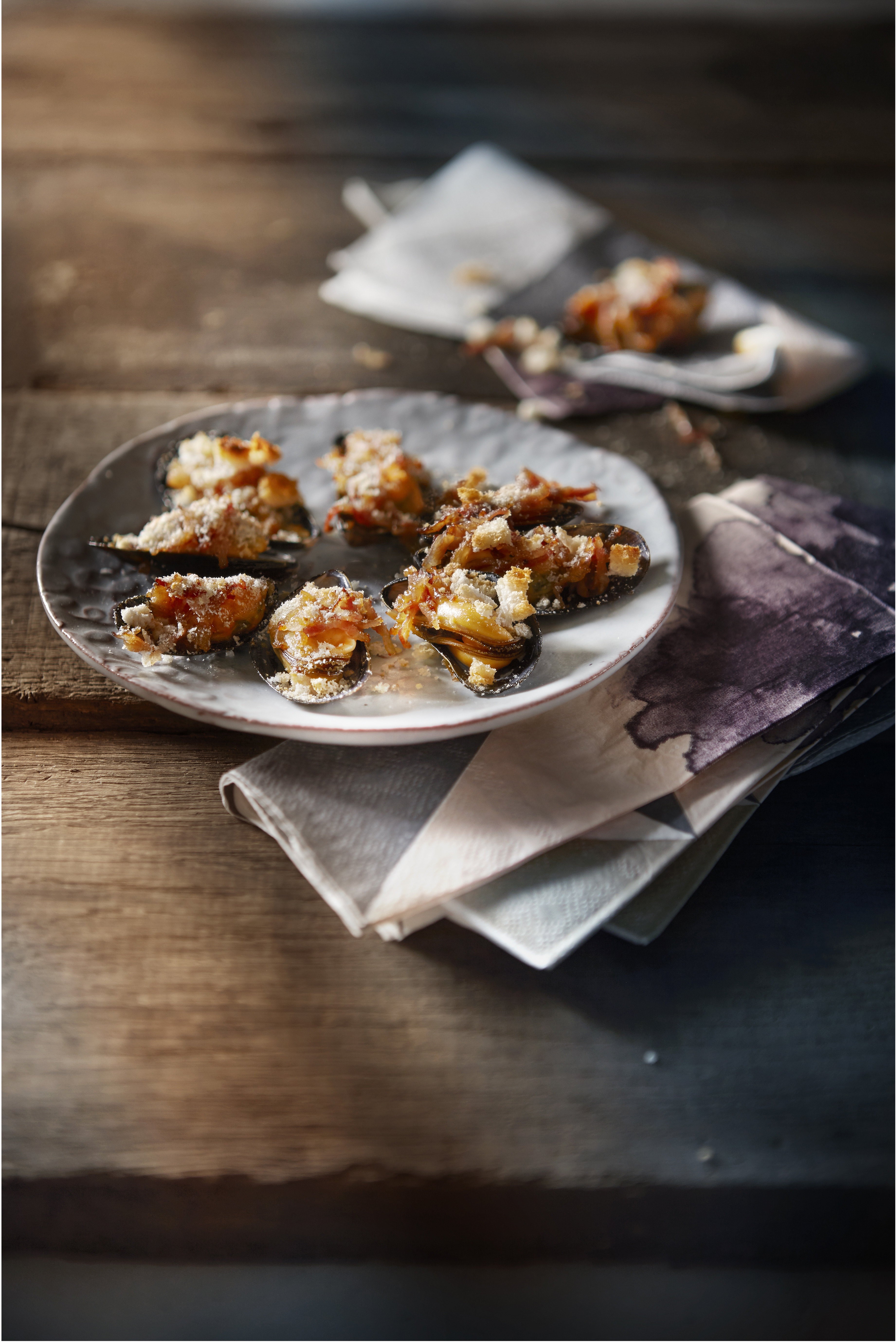 Gegratineerde mosselen met spek