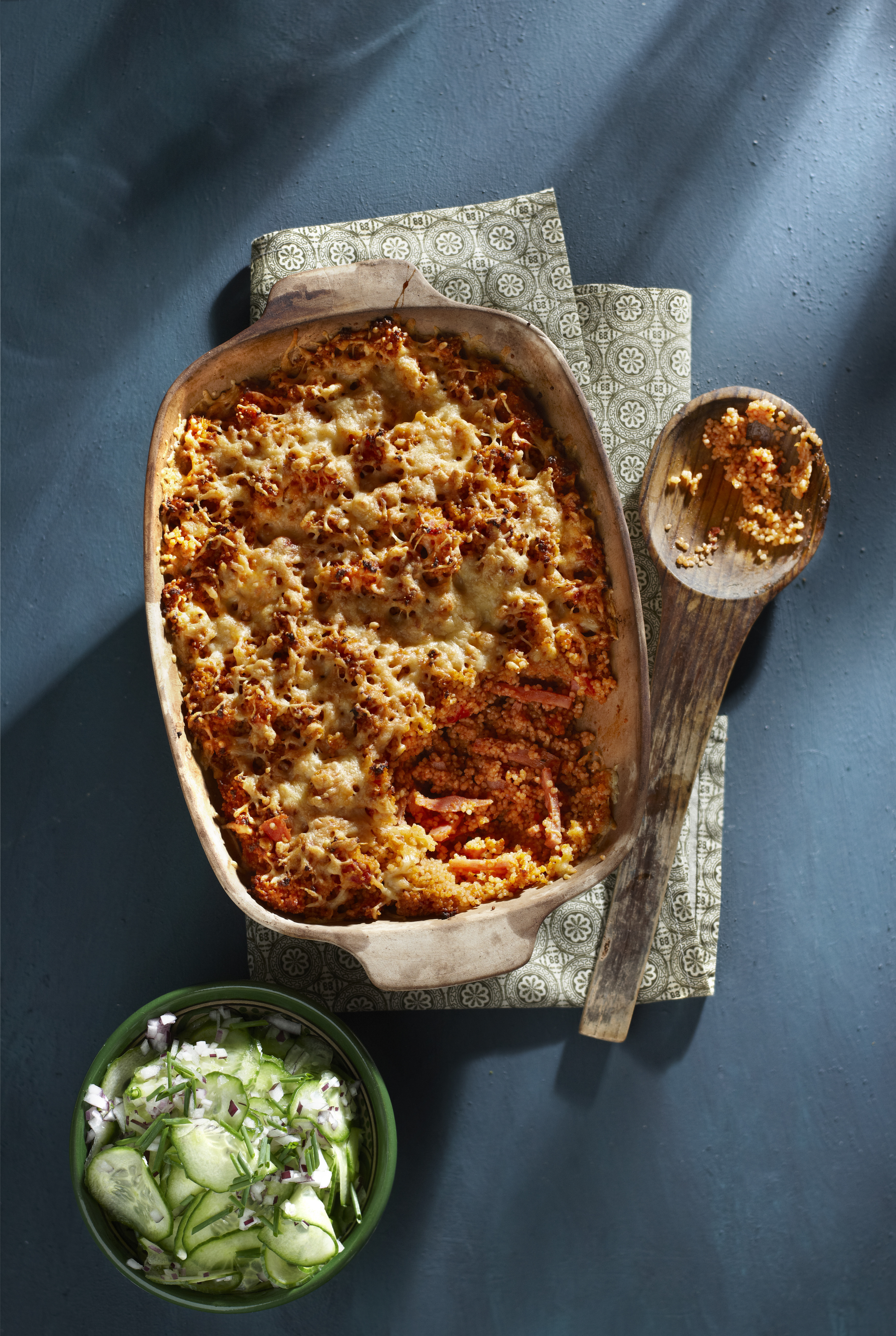 Gegratineerde couscous met ham en tomaat