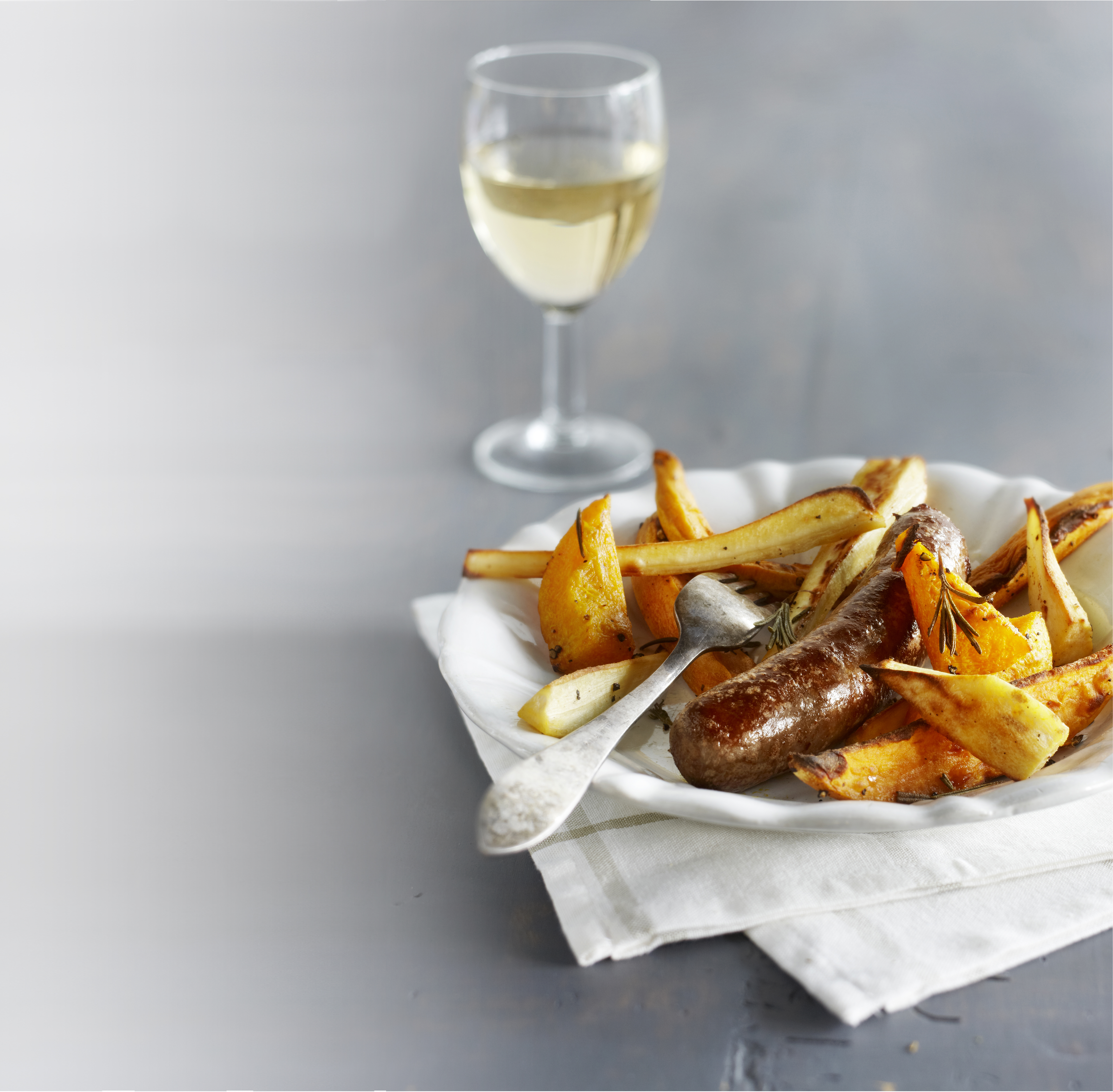 Pompoen en pastinaak met worst van de ovenplaat