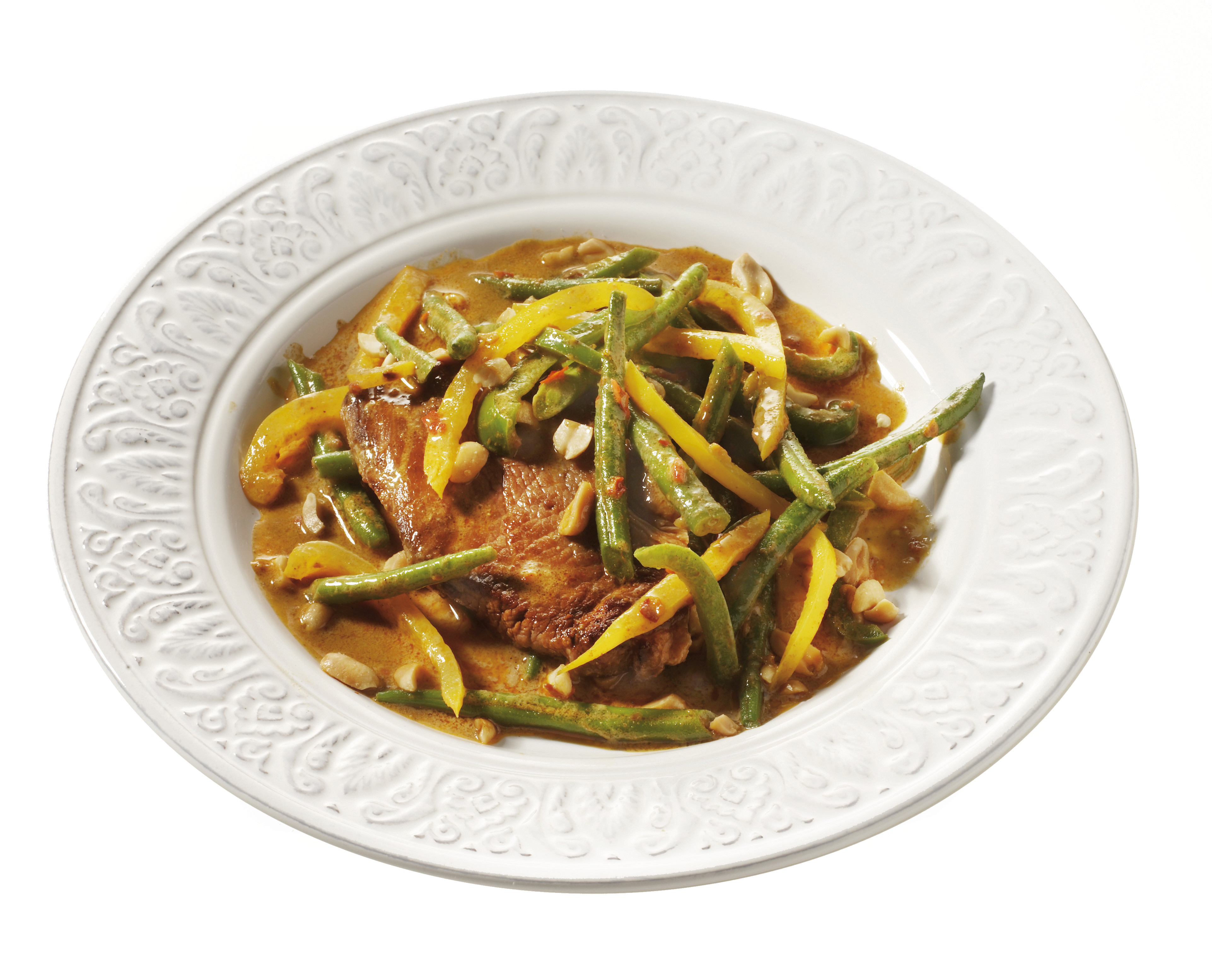 Varkensfilet met groentecurry en noten