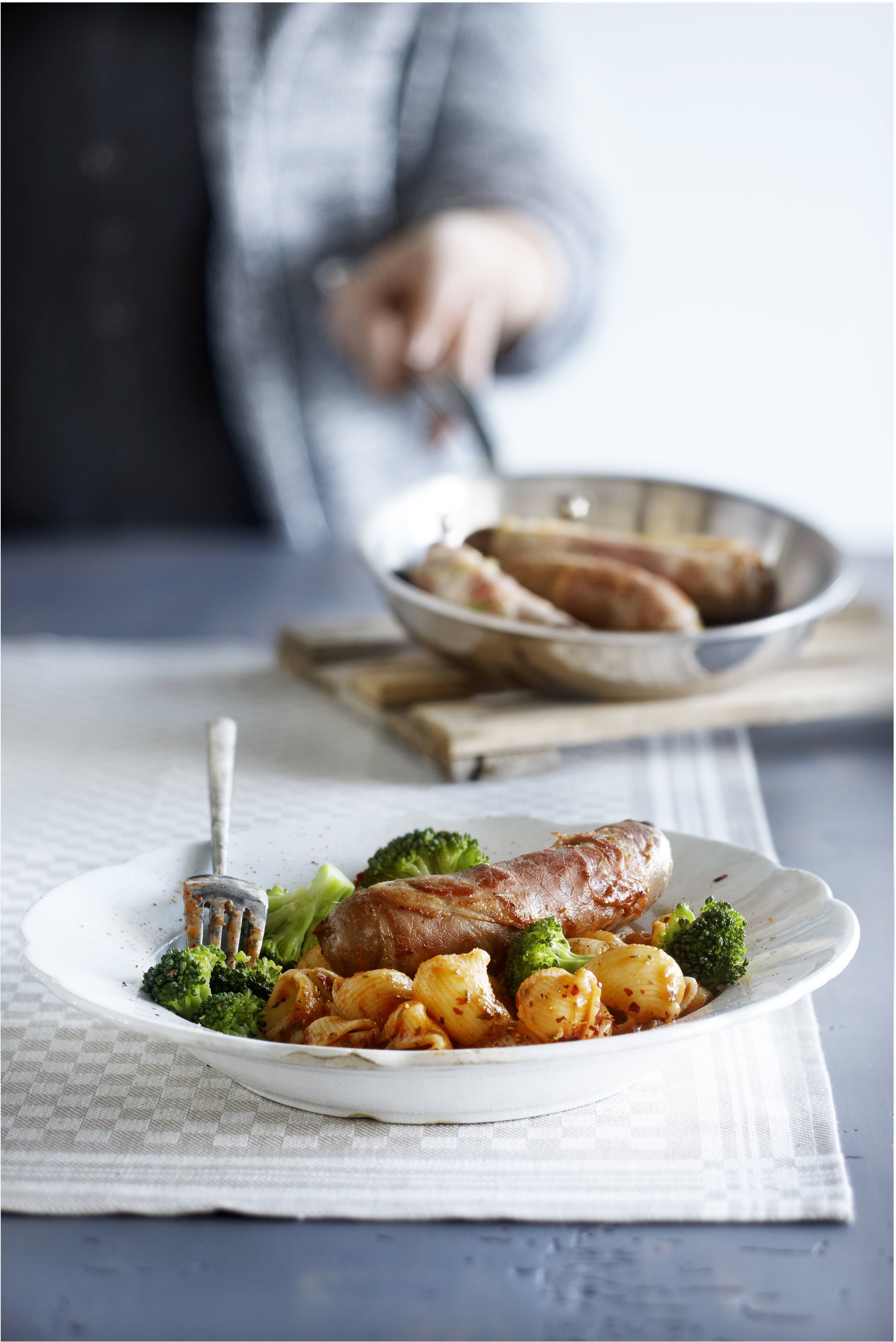 Varkensworstrolletjes met parmaham en salie