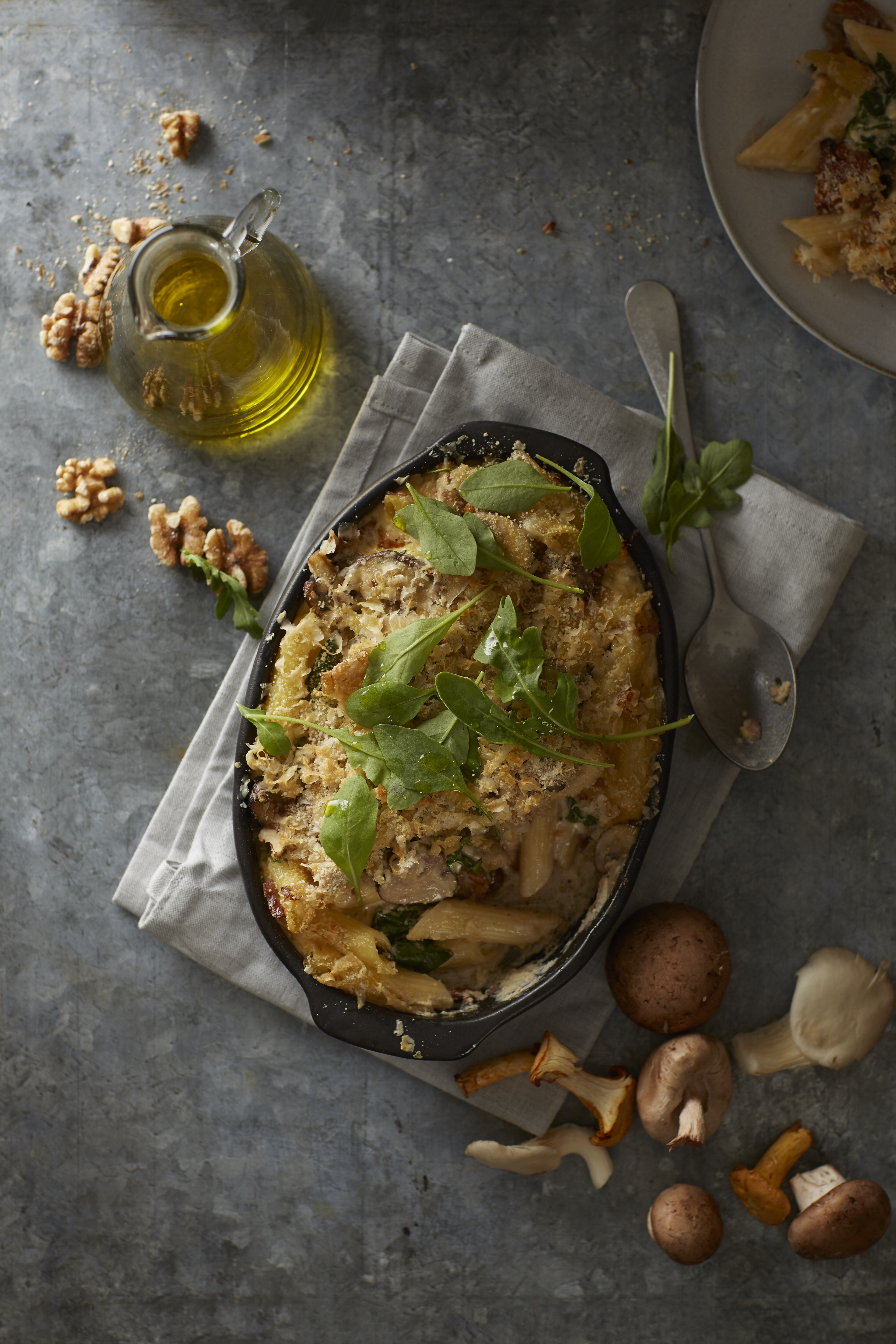 Penne uit de oven met pancetta en paddenstoelen
