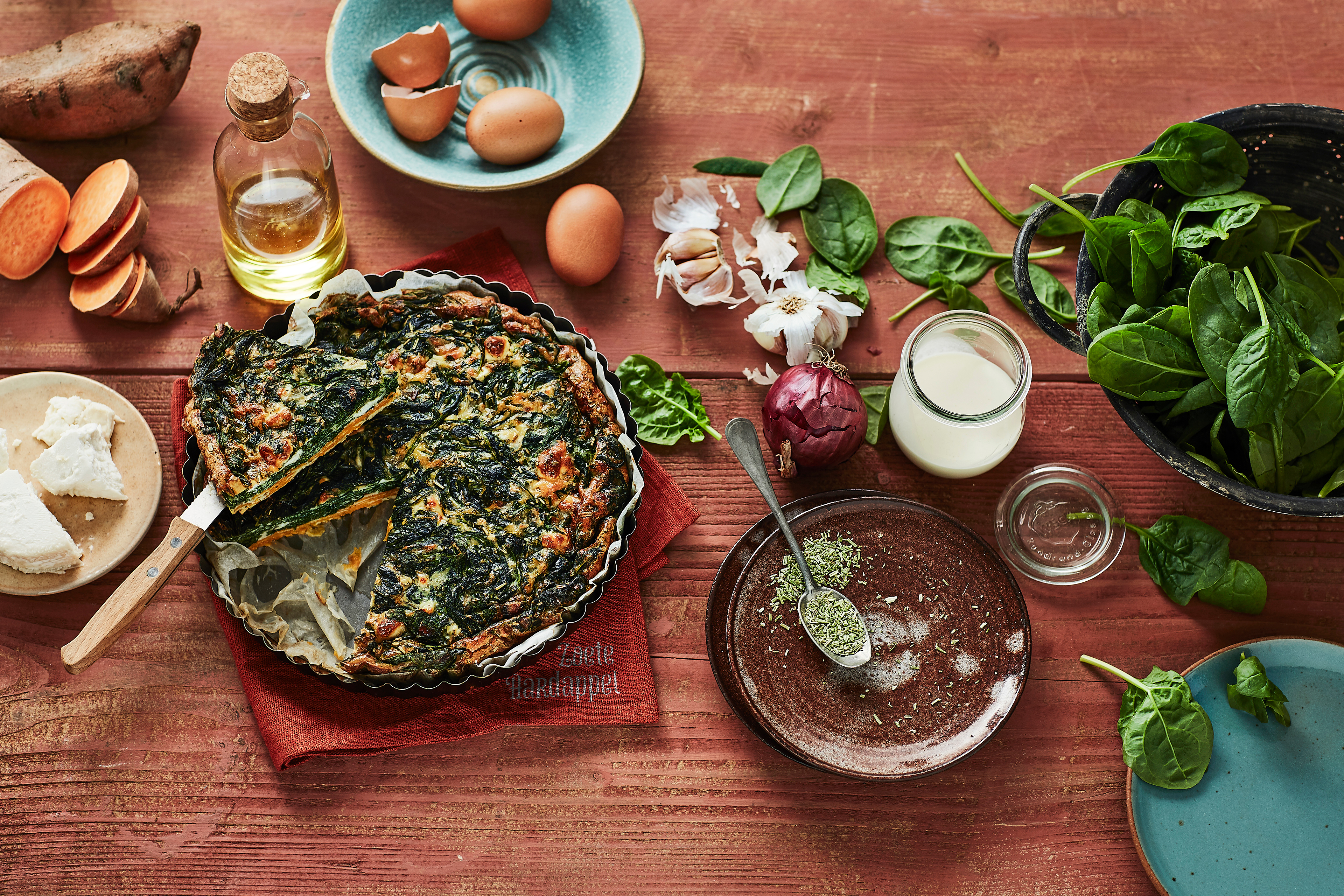 Quiche van zoete aardappel met spinazie en geitenkaas
