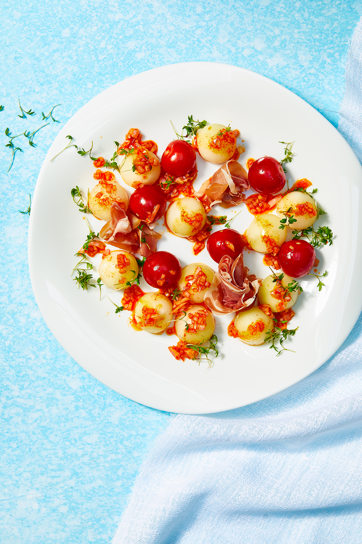 Honingmeloen met prosciutto en tomaatjes