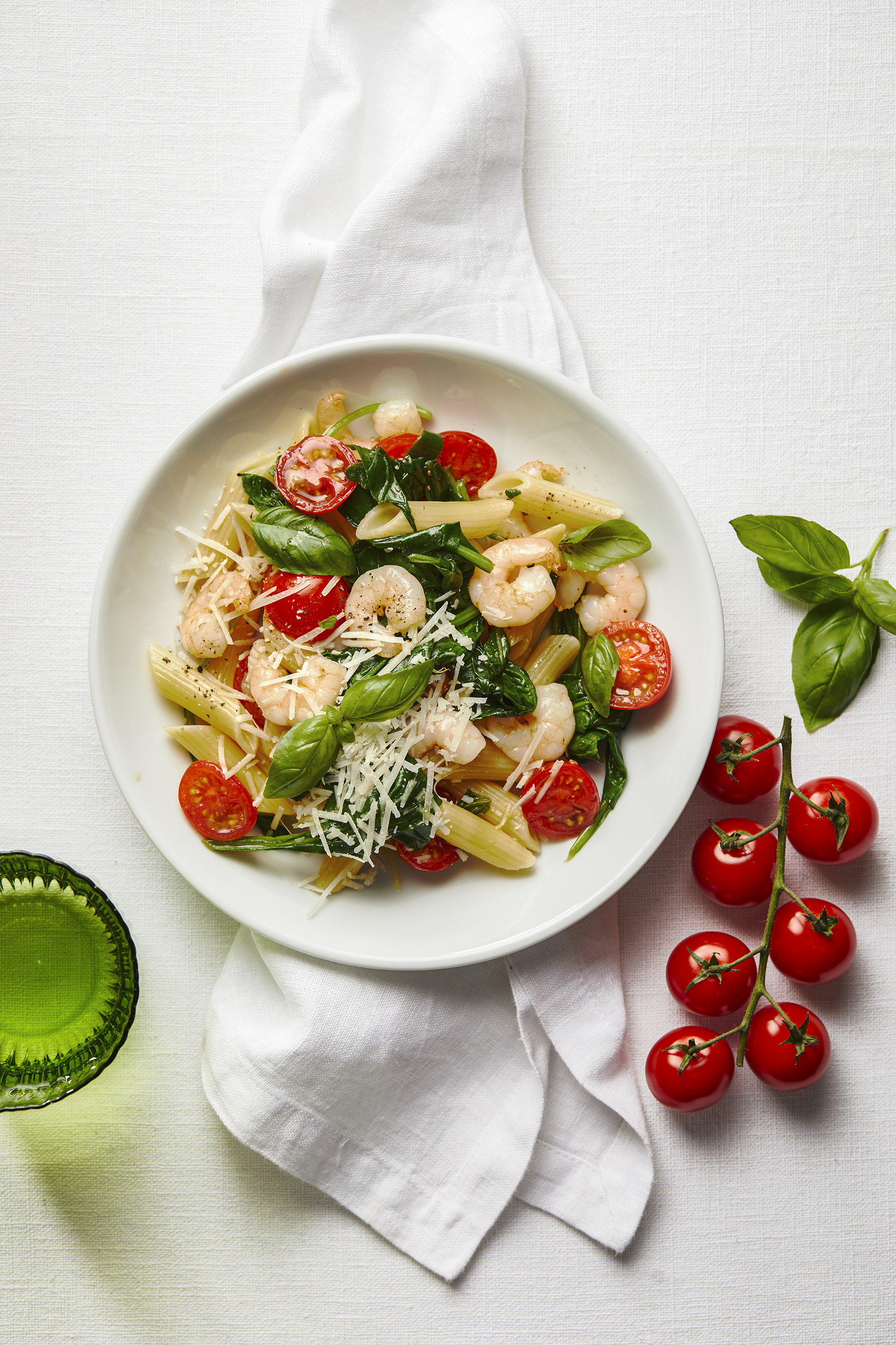 Penne met garnalen, tomaatjes en spinazie