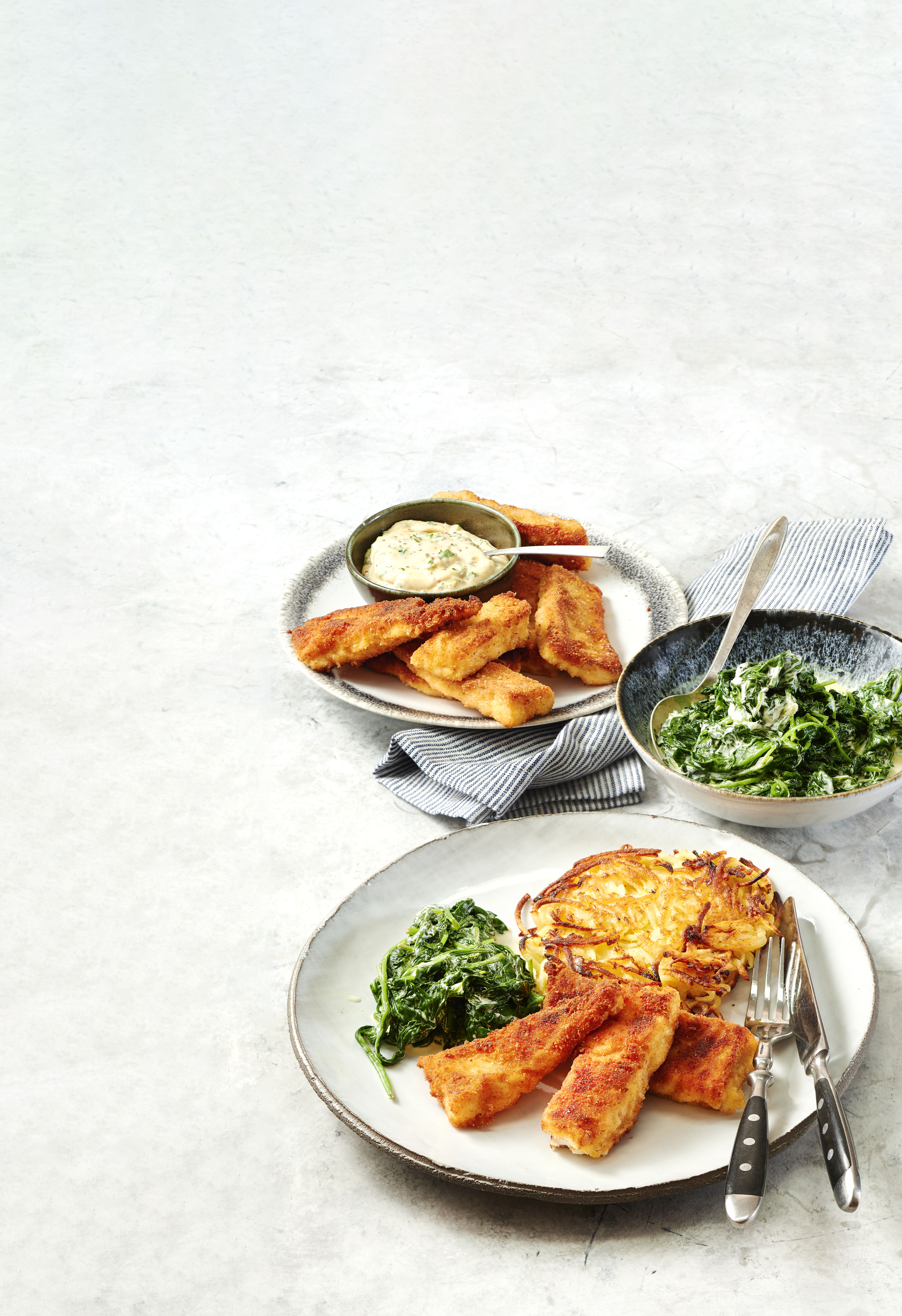 Zelfgemaakte vissticks met rösti en spinazie à la crème