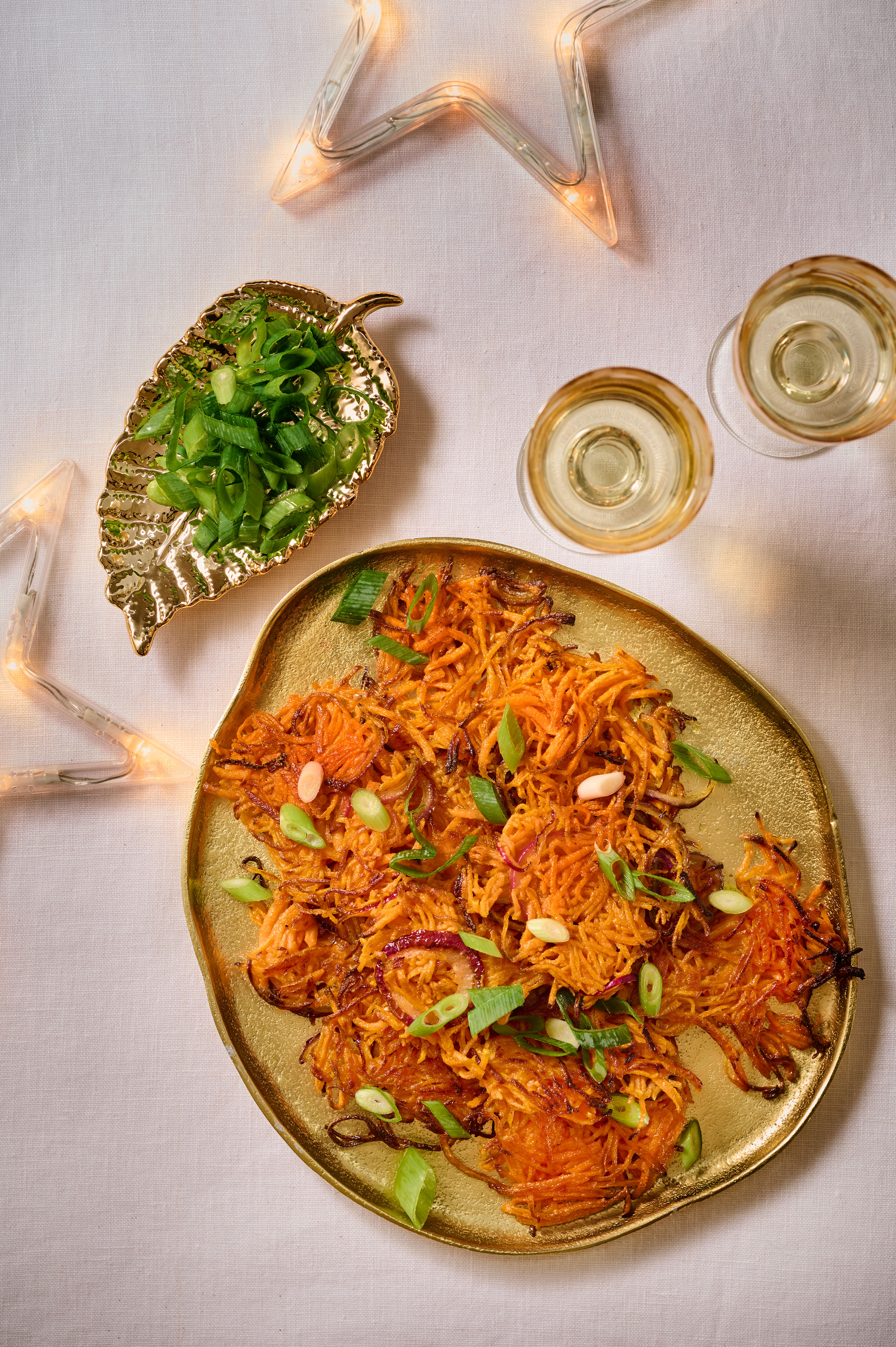 Rosti van zoete aardappel met bosui